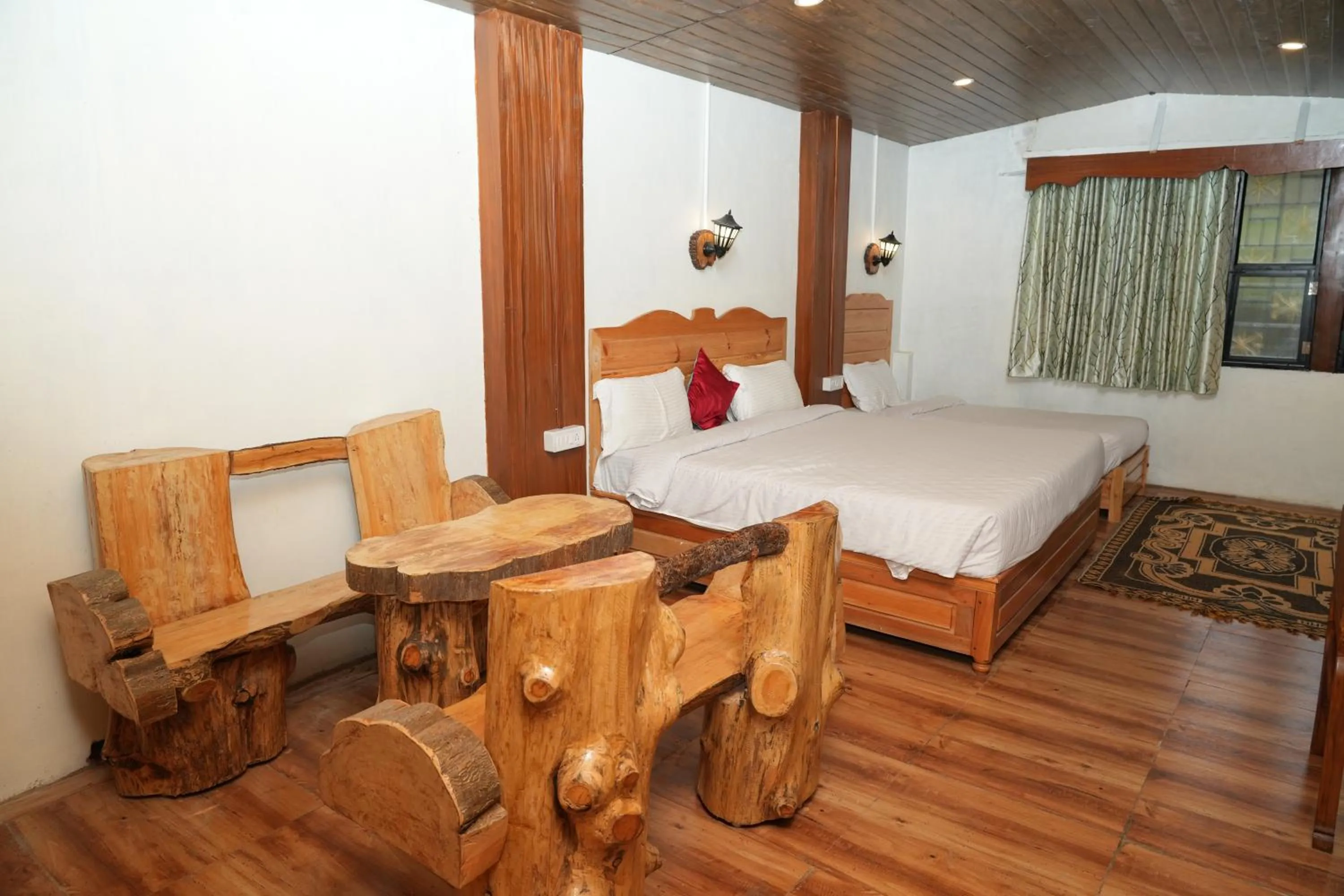 Bed in Vetrivel International by Brown Tree Resorts