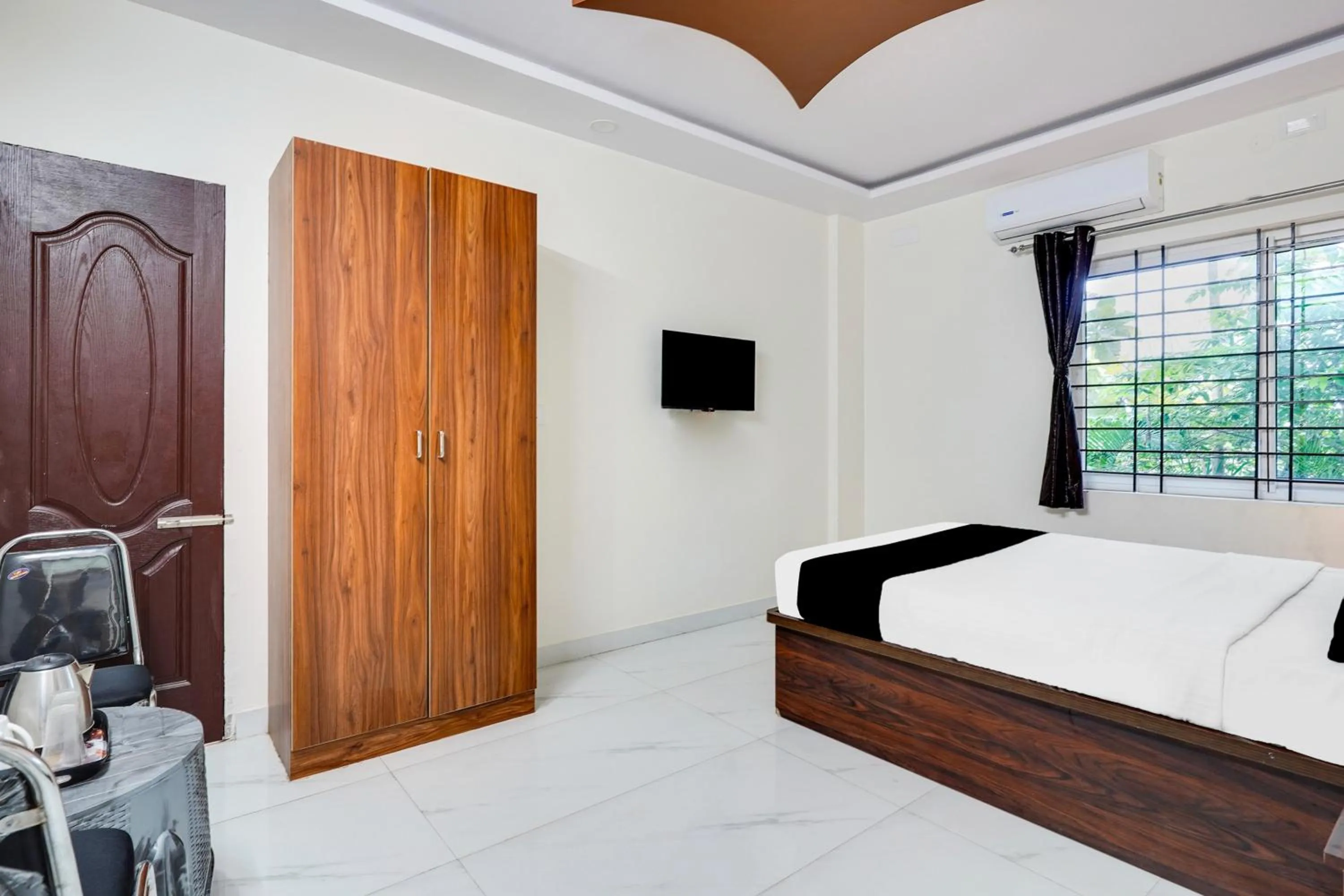 Bedroom in Super Townhouse Bidadi Formerly Royal Garuda