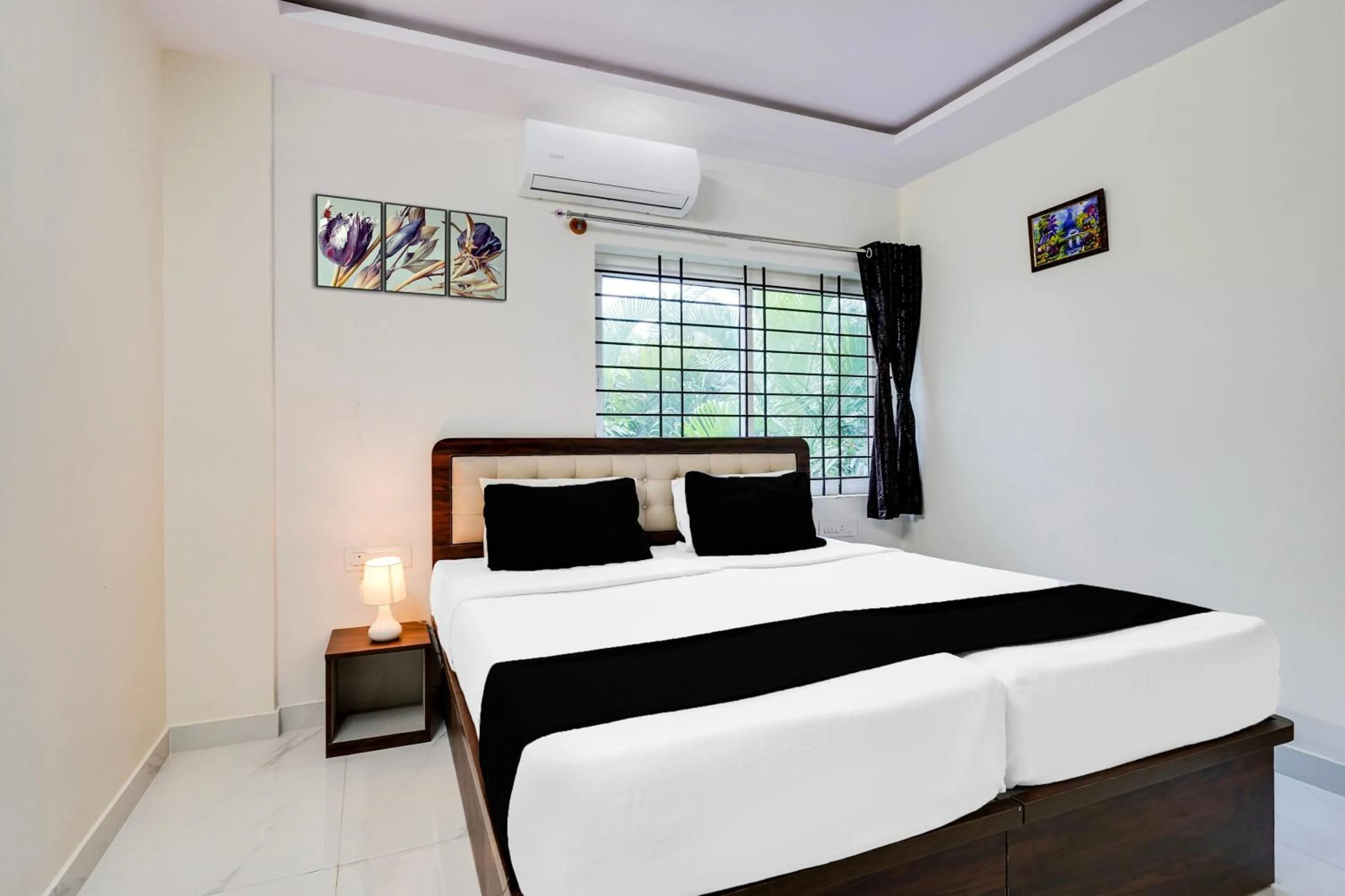 Bedroom in Super Townhouse Bidadi Formerly Royal Garuda