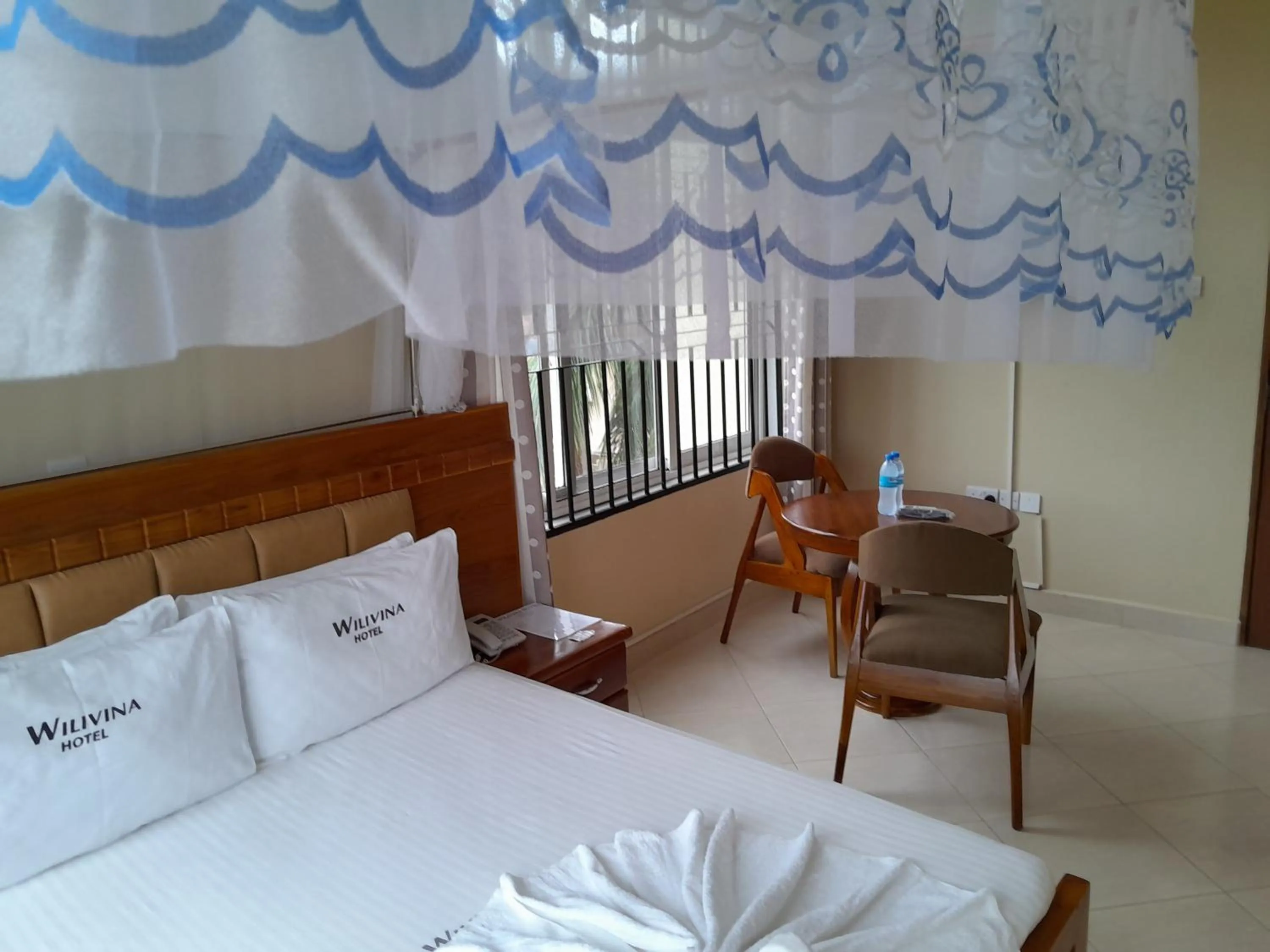 Seating area, Bed in WILIVINA HOTEL