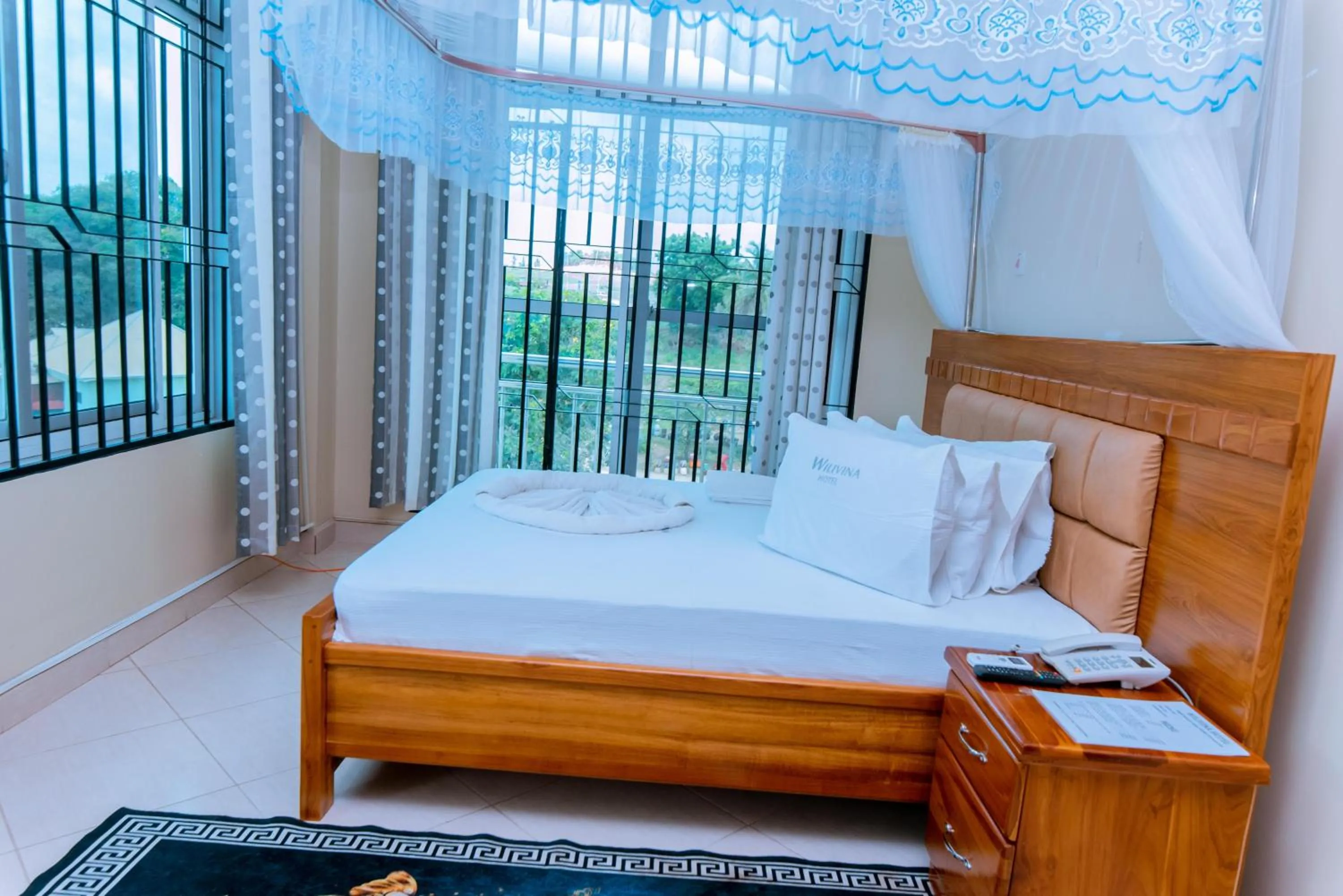 Bed in WILIVINA HOTEL