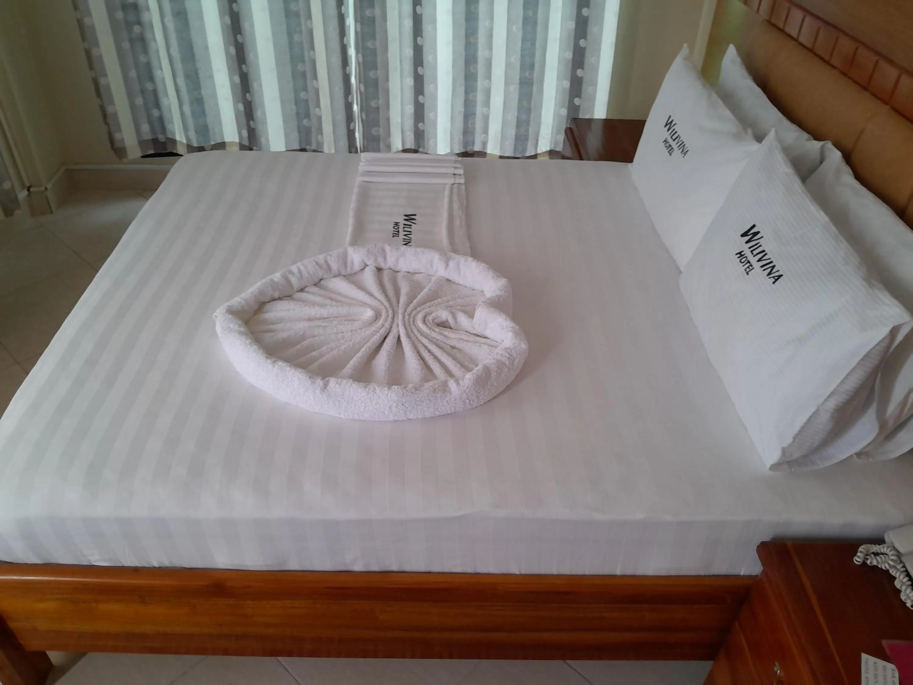 Bed in WILIVINA HOTEL