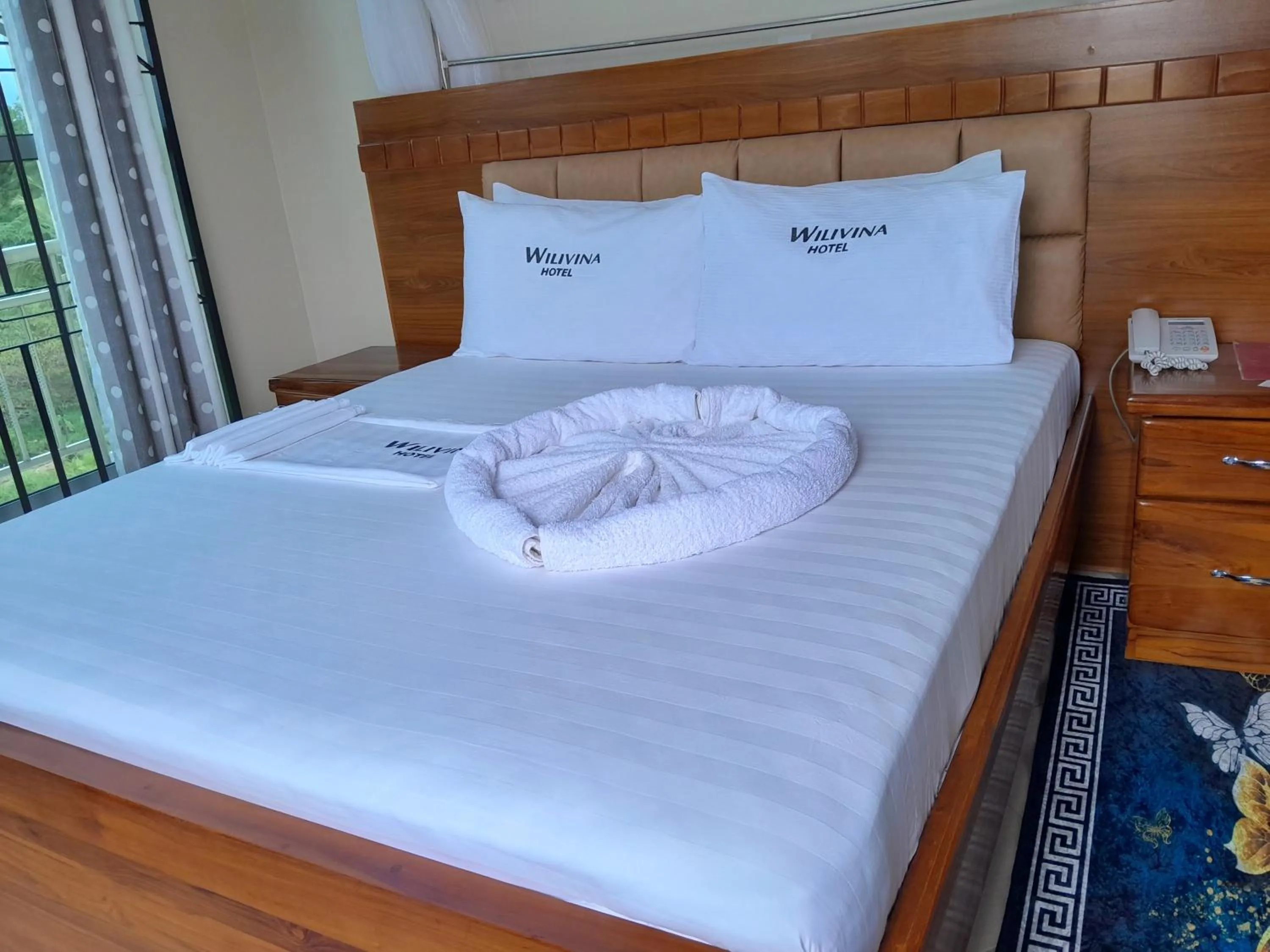 Bed in WILIVINA HOTEL