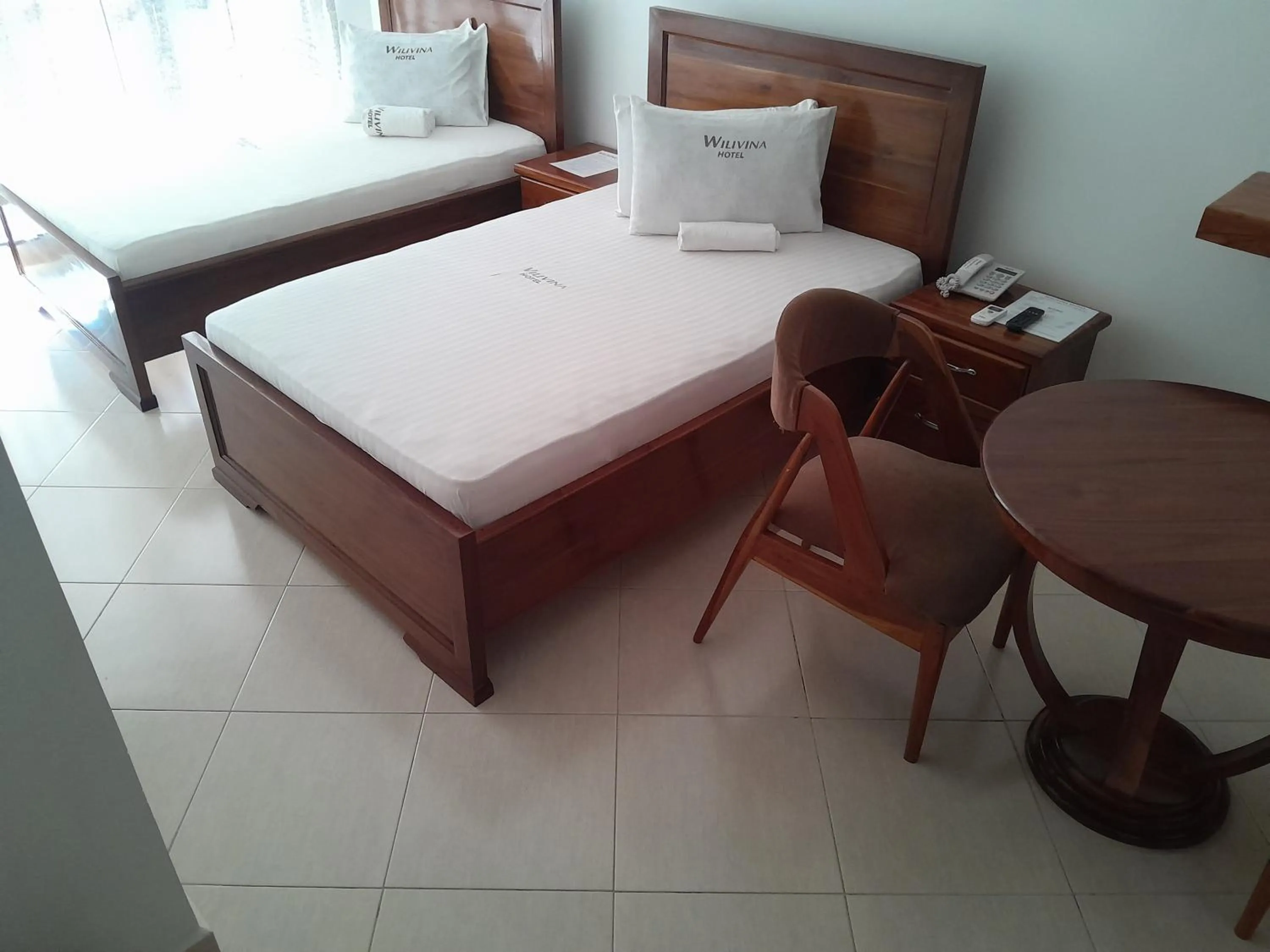 Bed in WILIVINA HOTEL