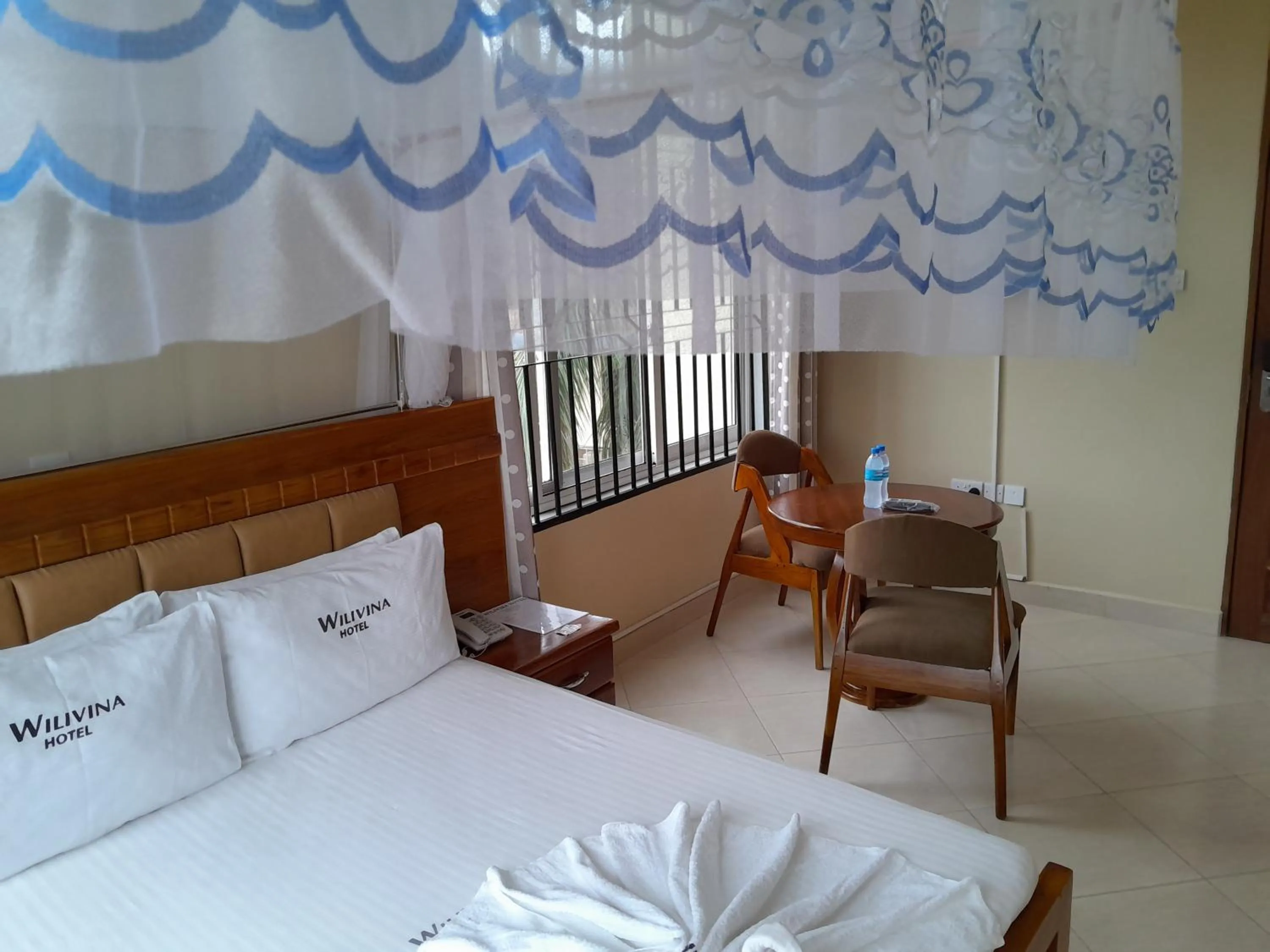 Bed in WILIVINA HOTEL