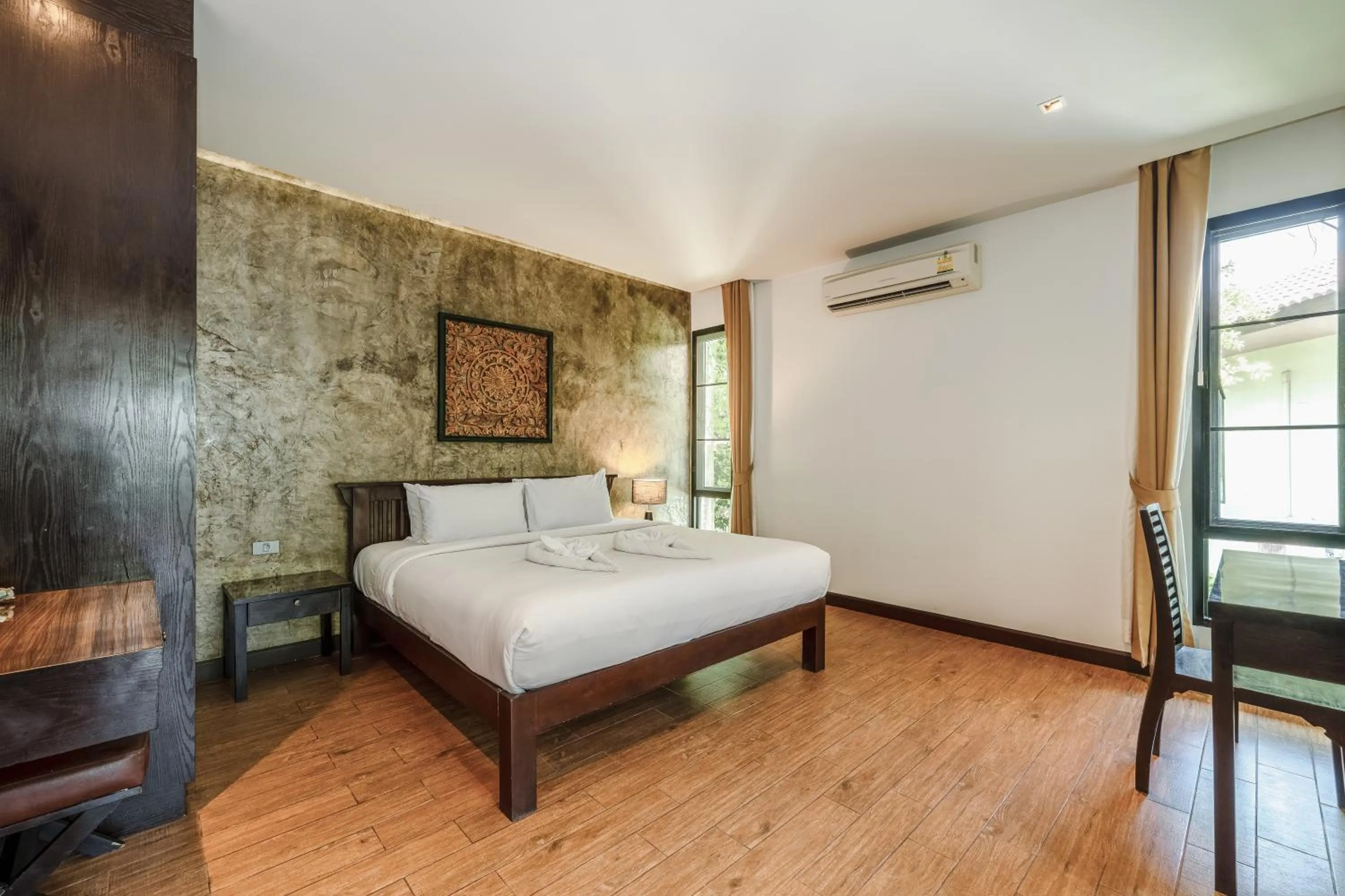 Bed in Coco Retreat Phuket Resort and Spa - SHA Plus