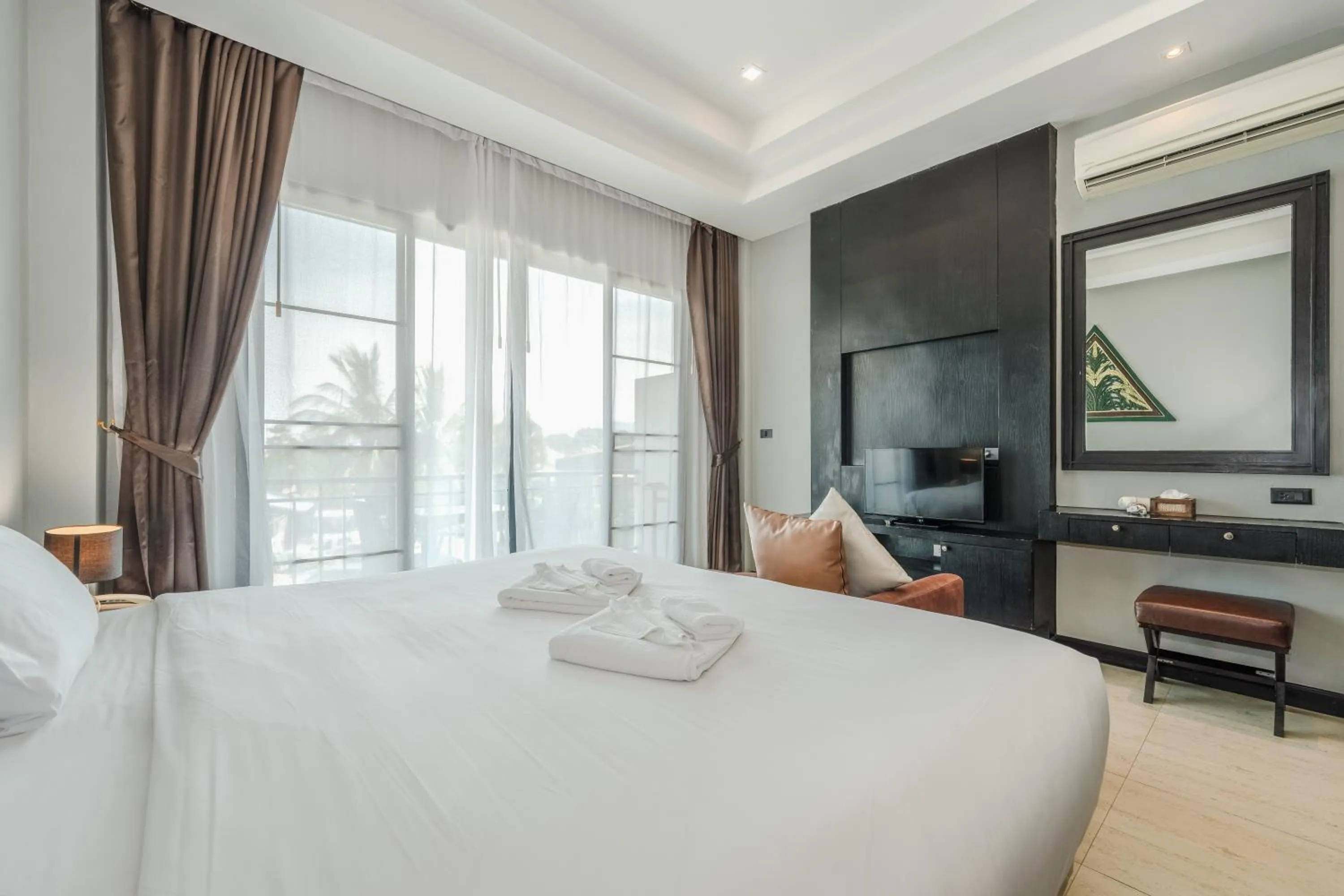 Bed in Coco Retreat Phuket Resort and Spa - SHA Plus