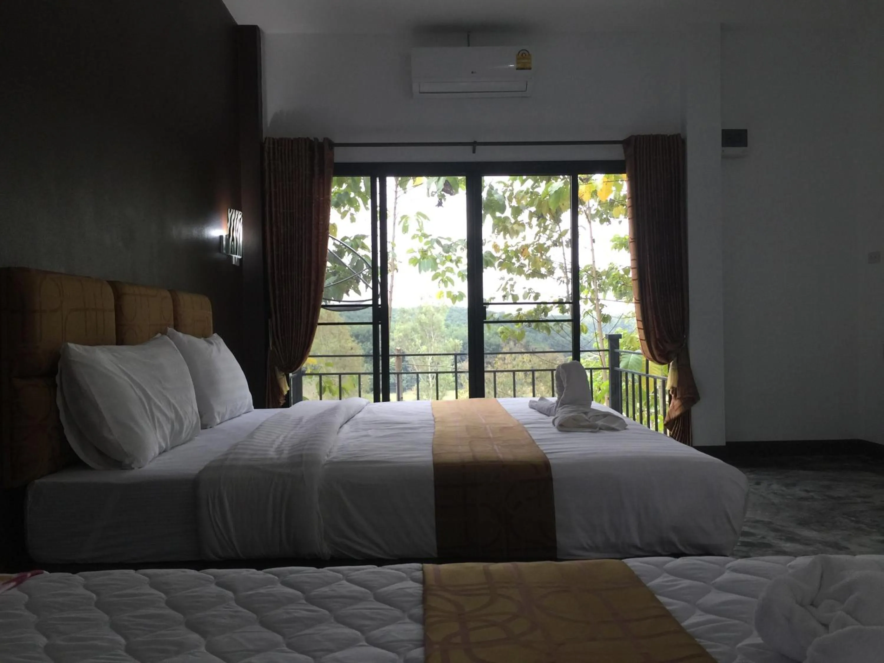 Bed in Baan Rai Phufah Resort Chiangrai