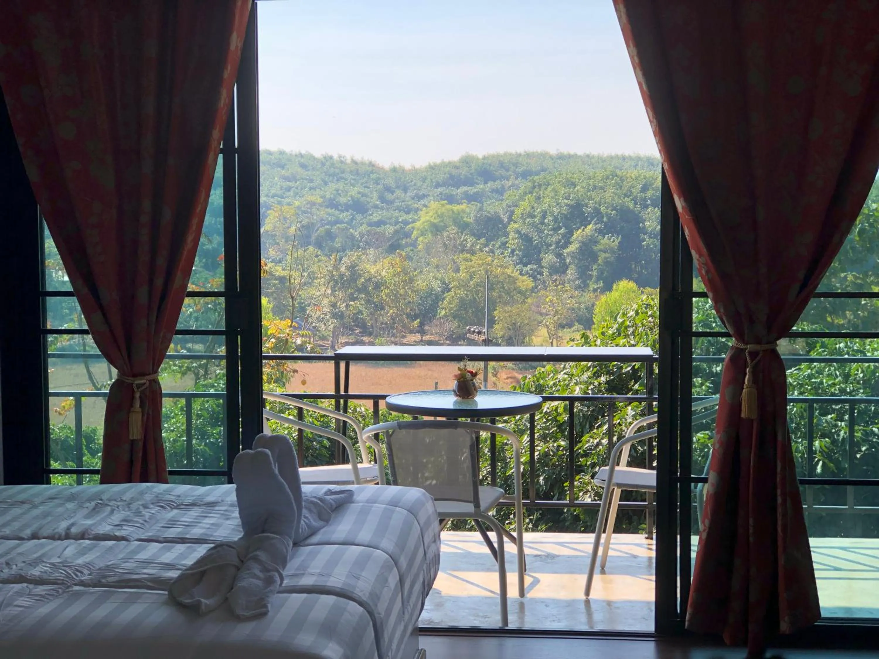 Bed in Baan Rai Phufah Resort Chiangrai