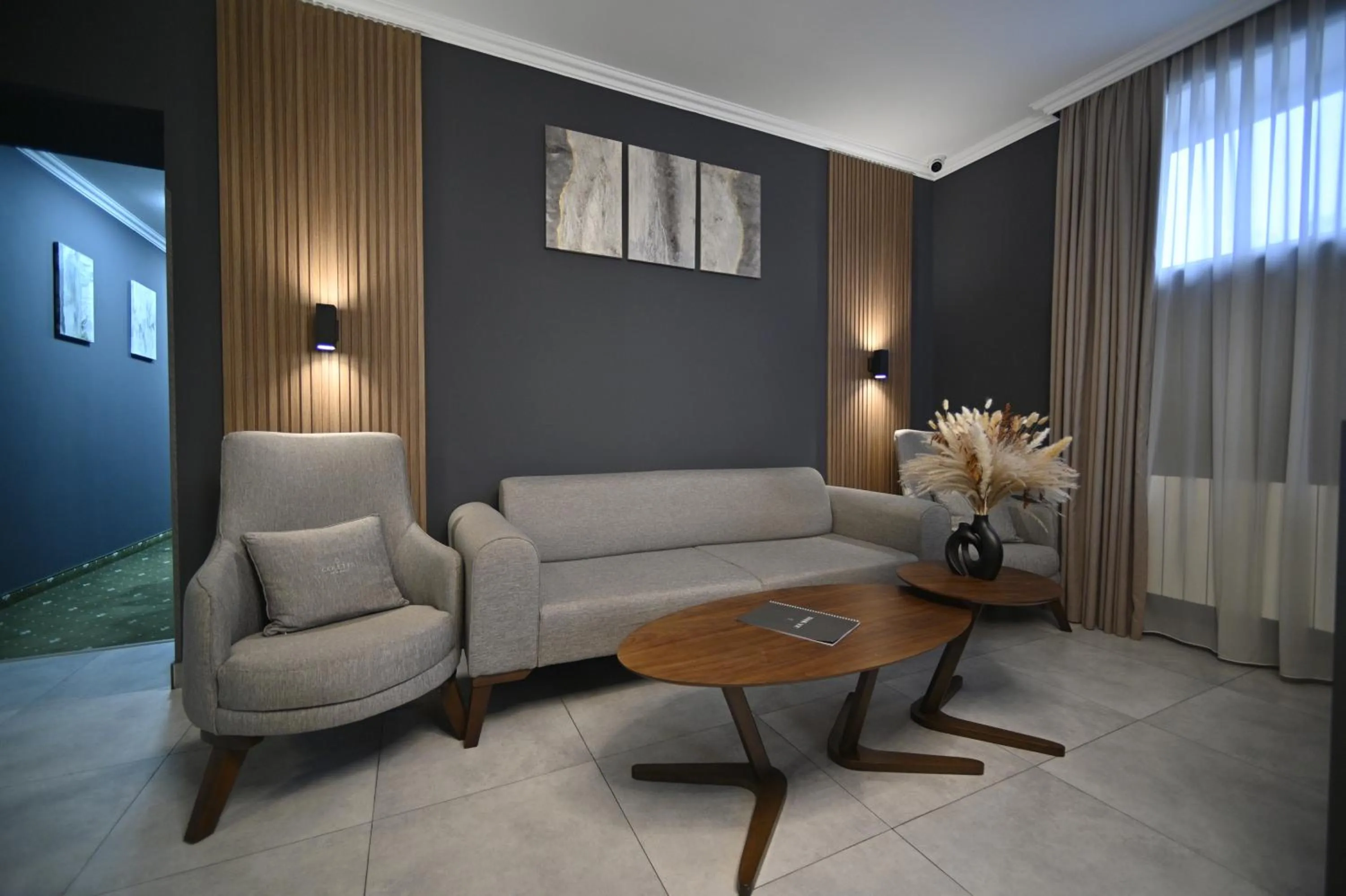 Communal lounge/ TV room in Colette Hotel