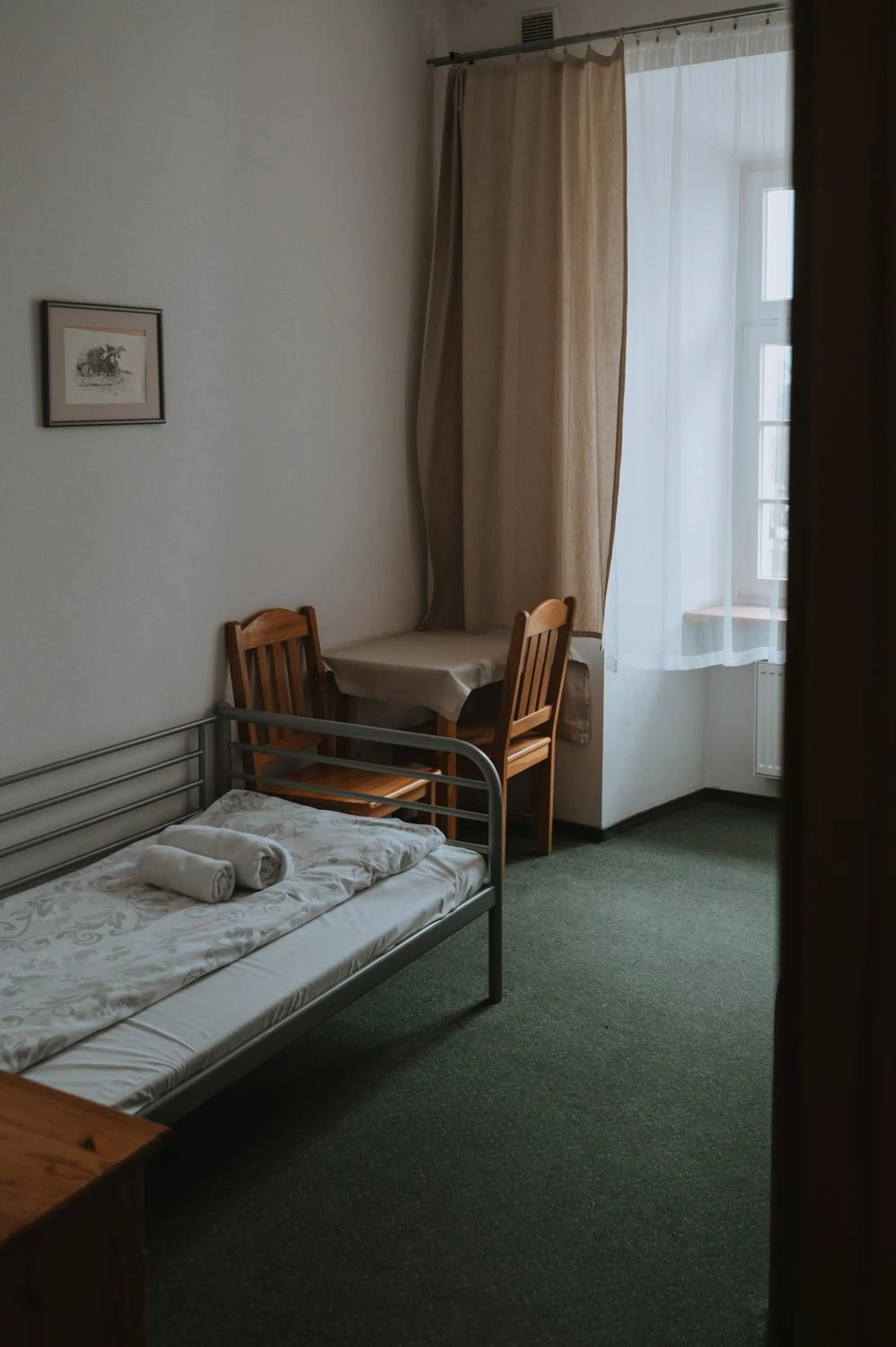 Bed in Pokoje Gościnne Domu Pielgrzyma w Supraślu
