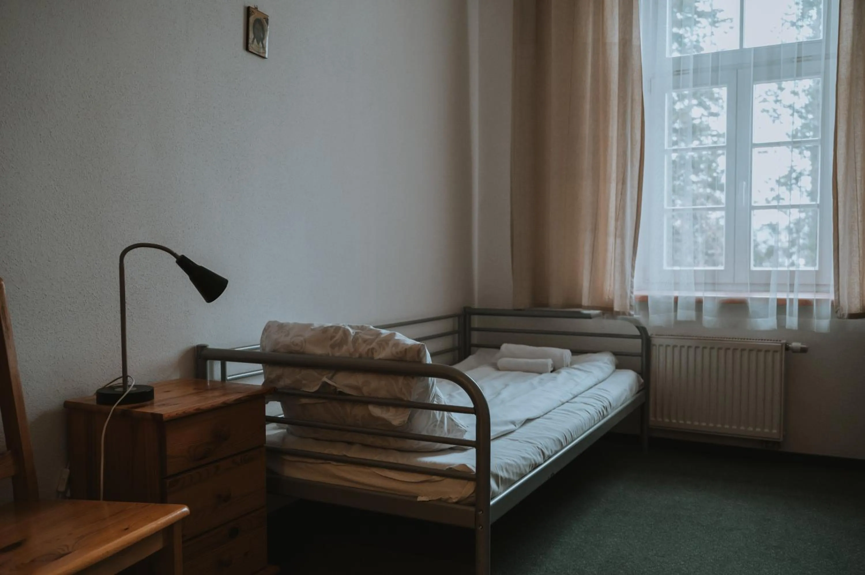 Bed in Pokoje Gościnne Domu Pielgrzyma w Supraślu