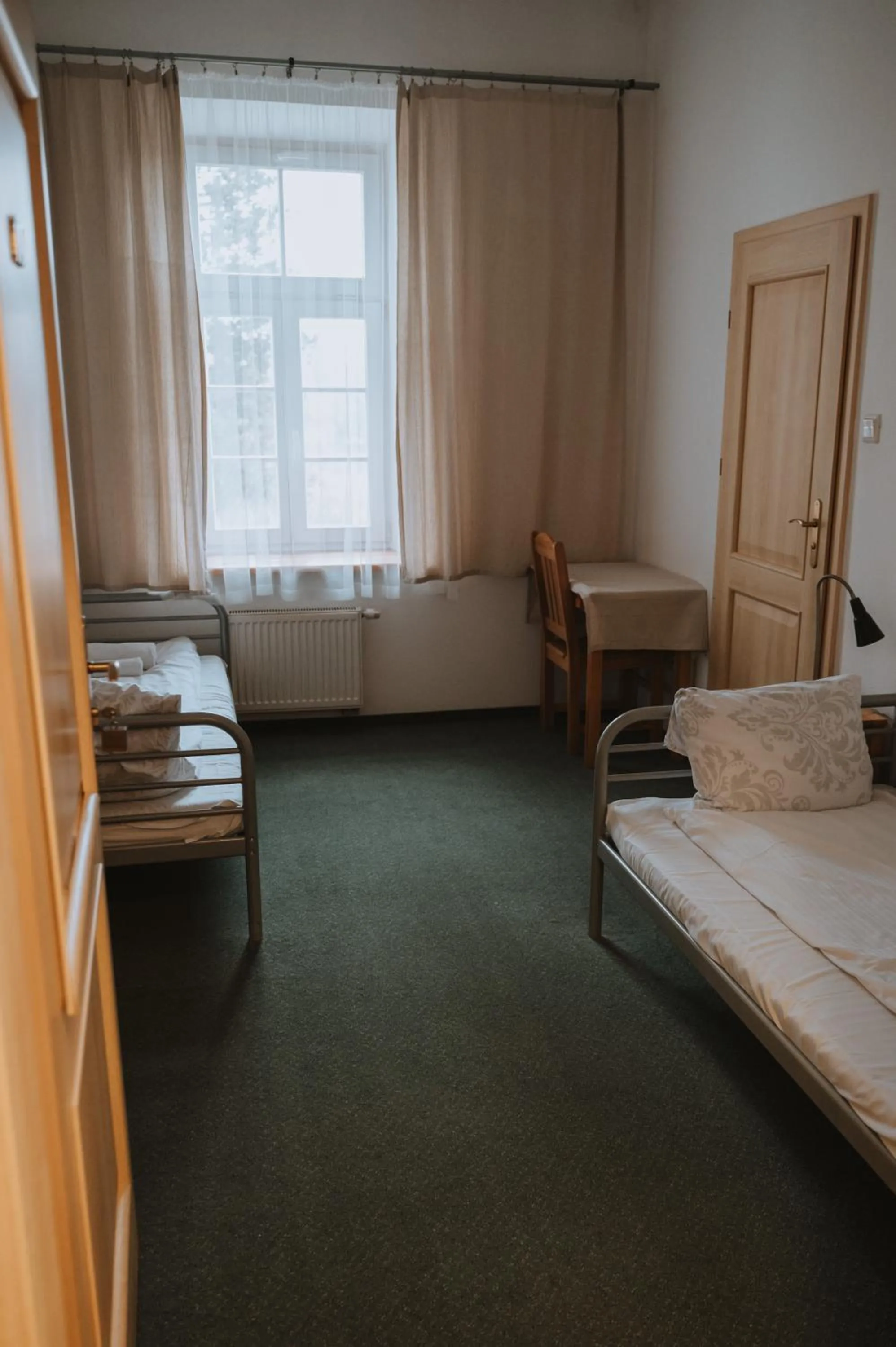 Bed in Pokoje Gościnne Domu Pielgrzyma w Supraślu