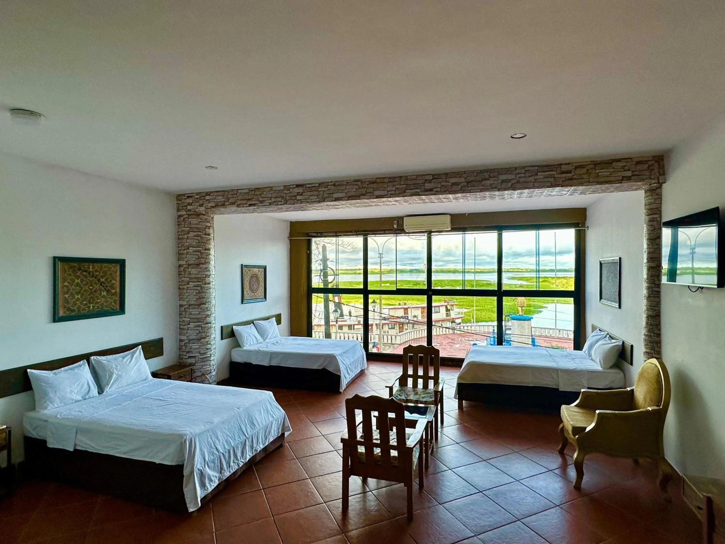 Photo of the whole room, Bed in La Posada del Cauchero Hotel & Suites
