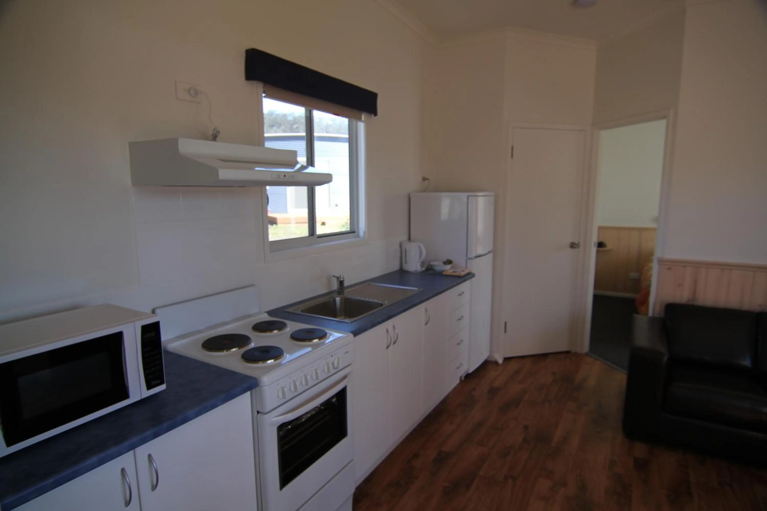 Kitchen or kitchenette in Bicheno East Coast Holiday Park