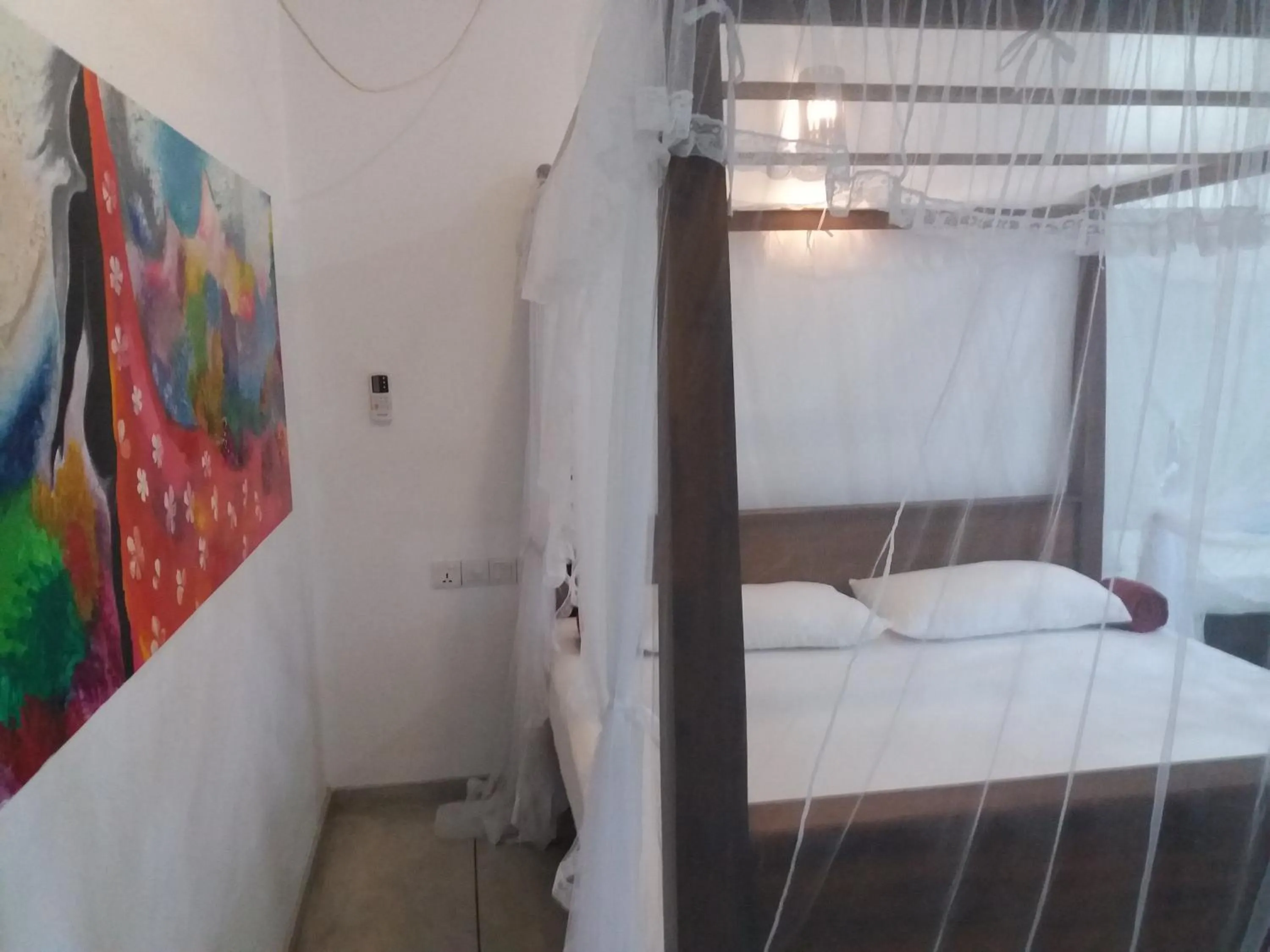 Decorative detail, Bed in Peacock Wings Guest