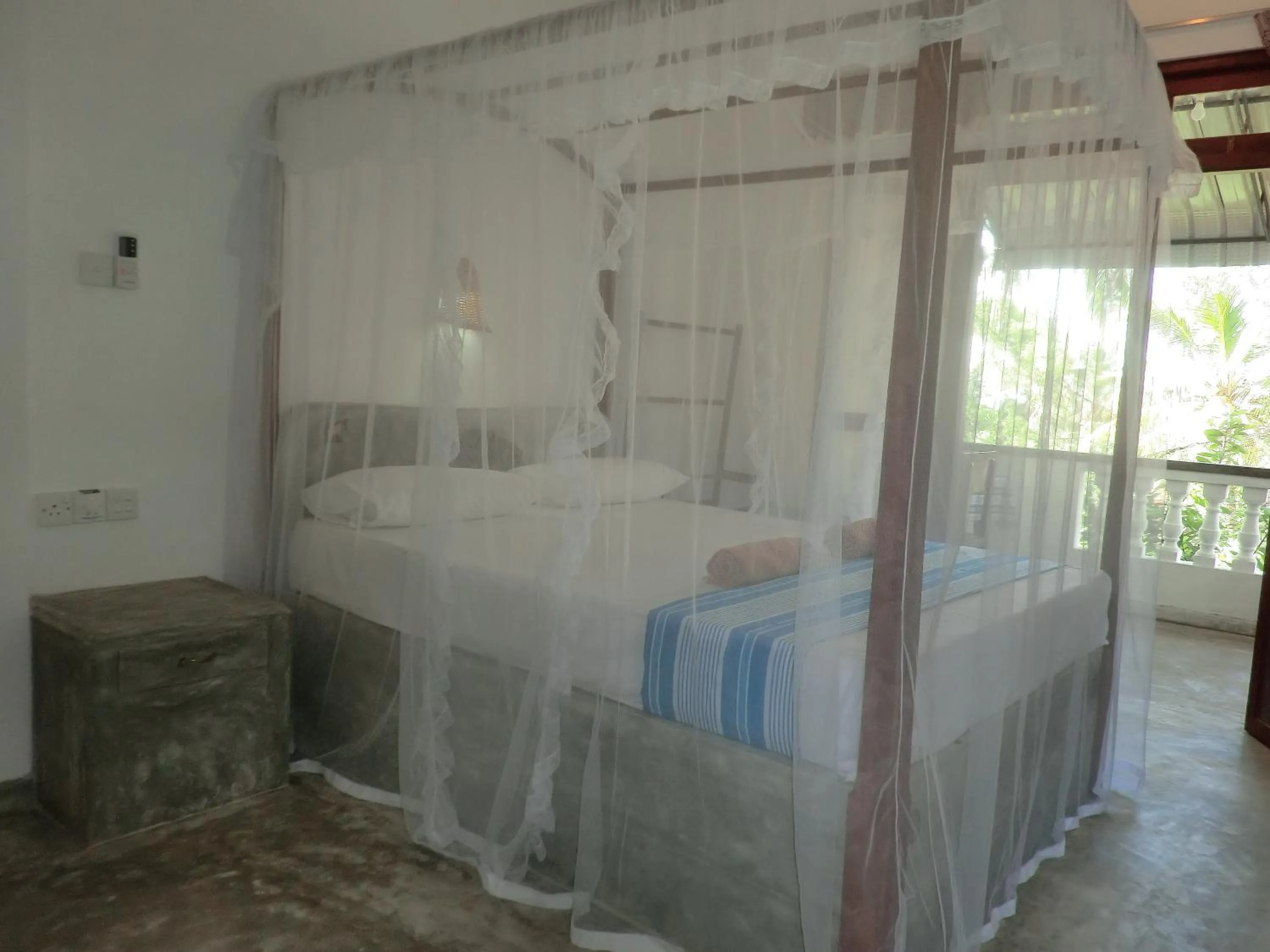 Bed in Peacock Wings Guest