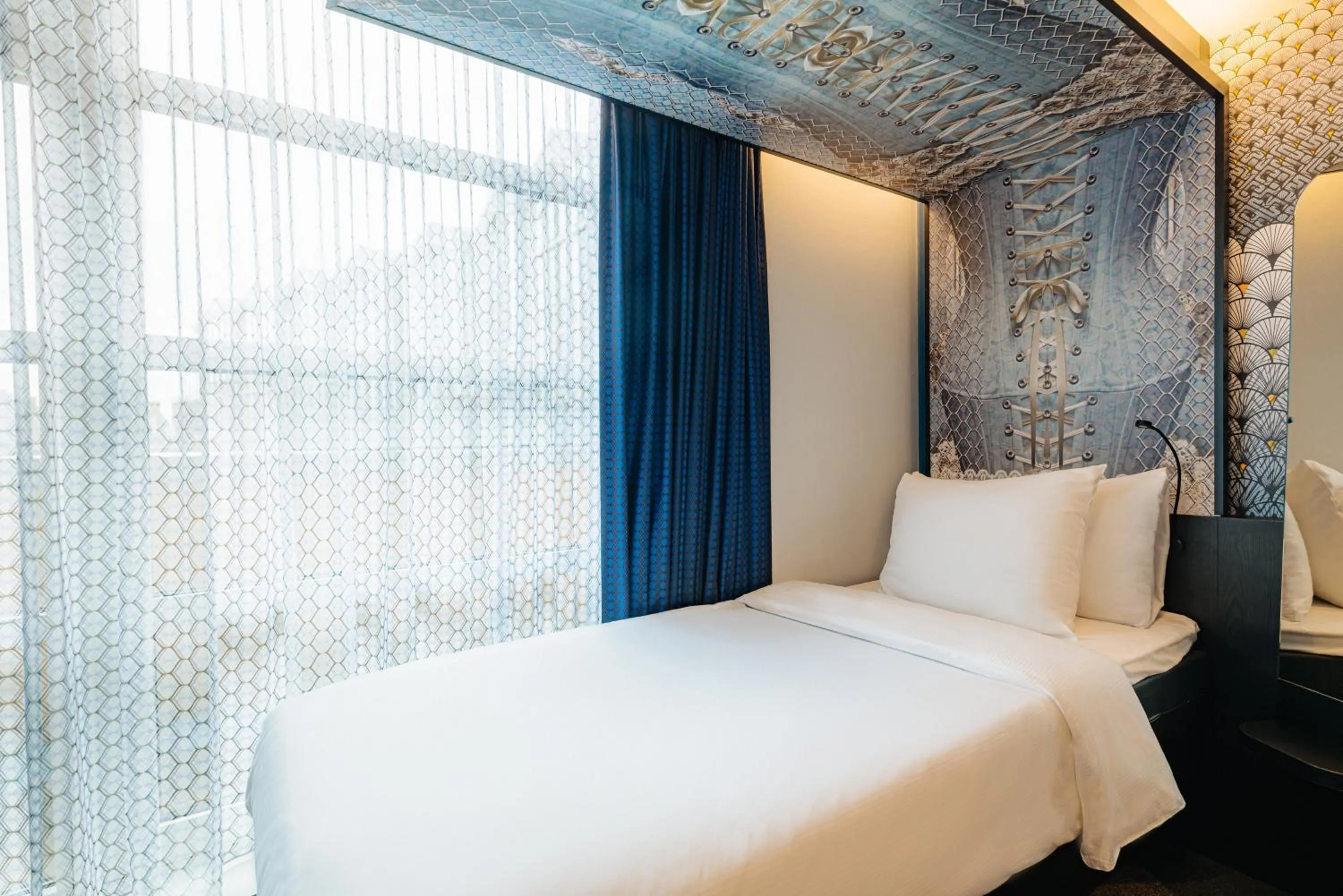 Photo of the whole room, Bed in NYX Hotel Amsterdam Rembrandt Square