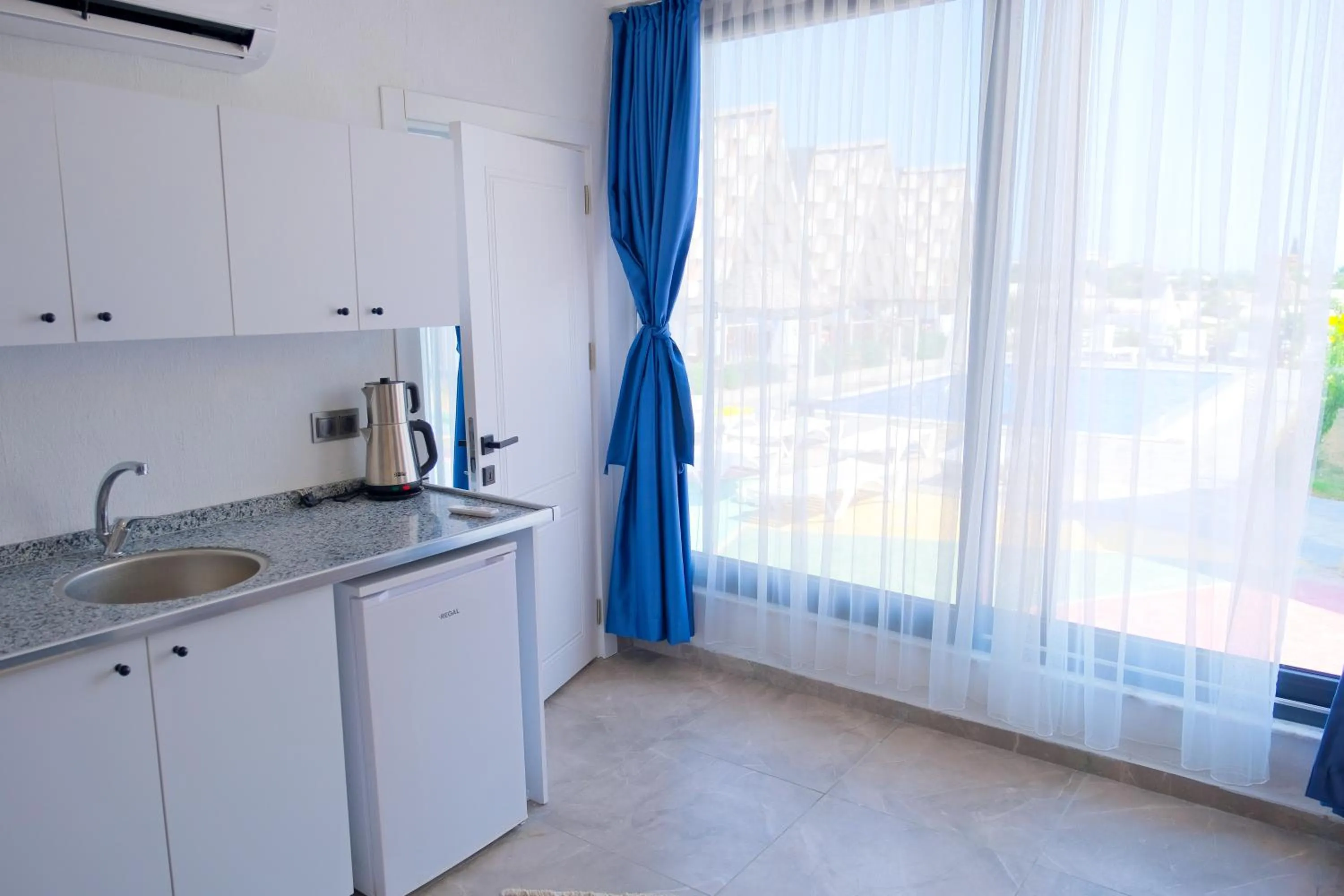 Kitchen or kitchenette in Bu Bungalow Hotel