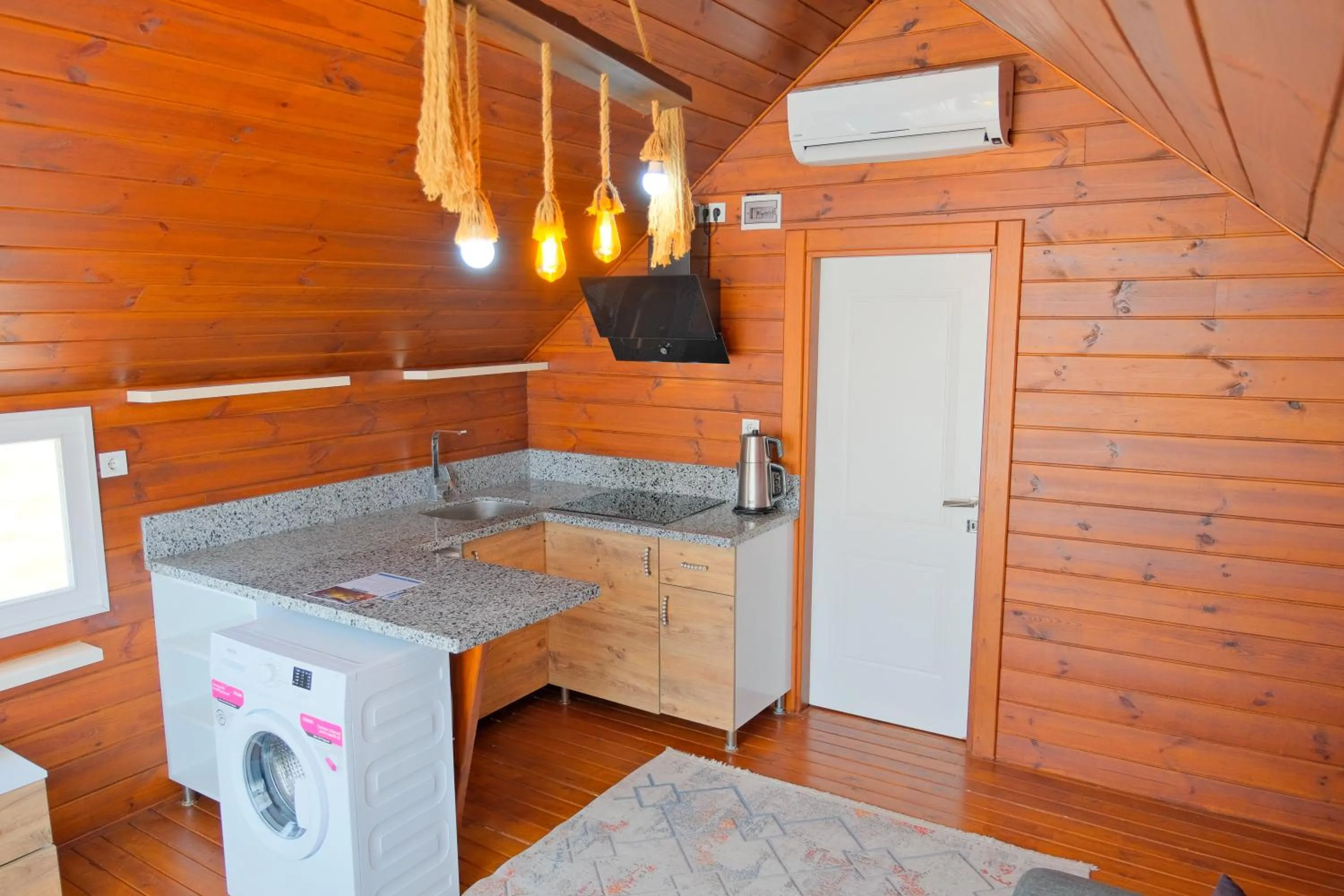 washing machine in Bu Bungalow Hotel
