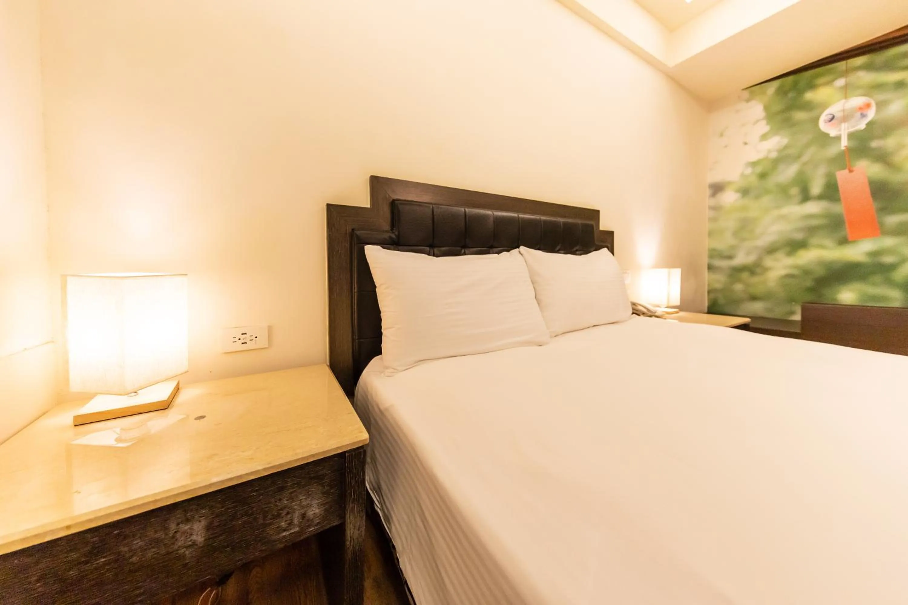 Bed in I HI Sanduo Travel Hotel