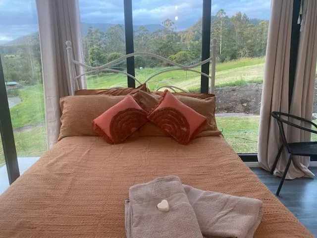 Bed in Nimbin waterfall retreat