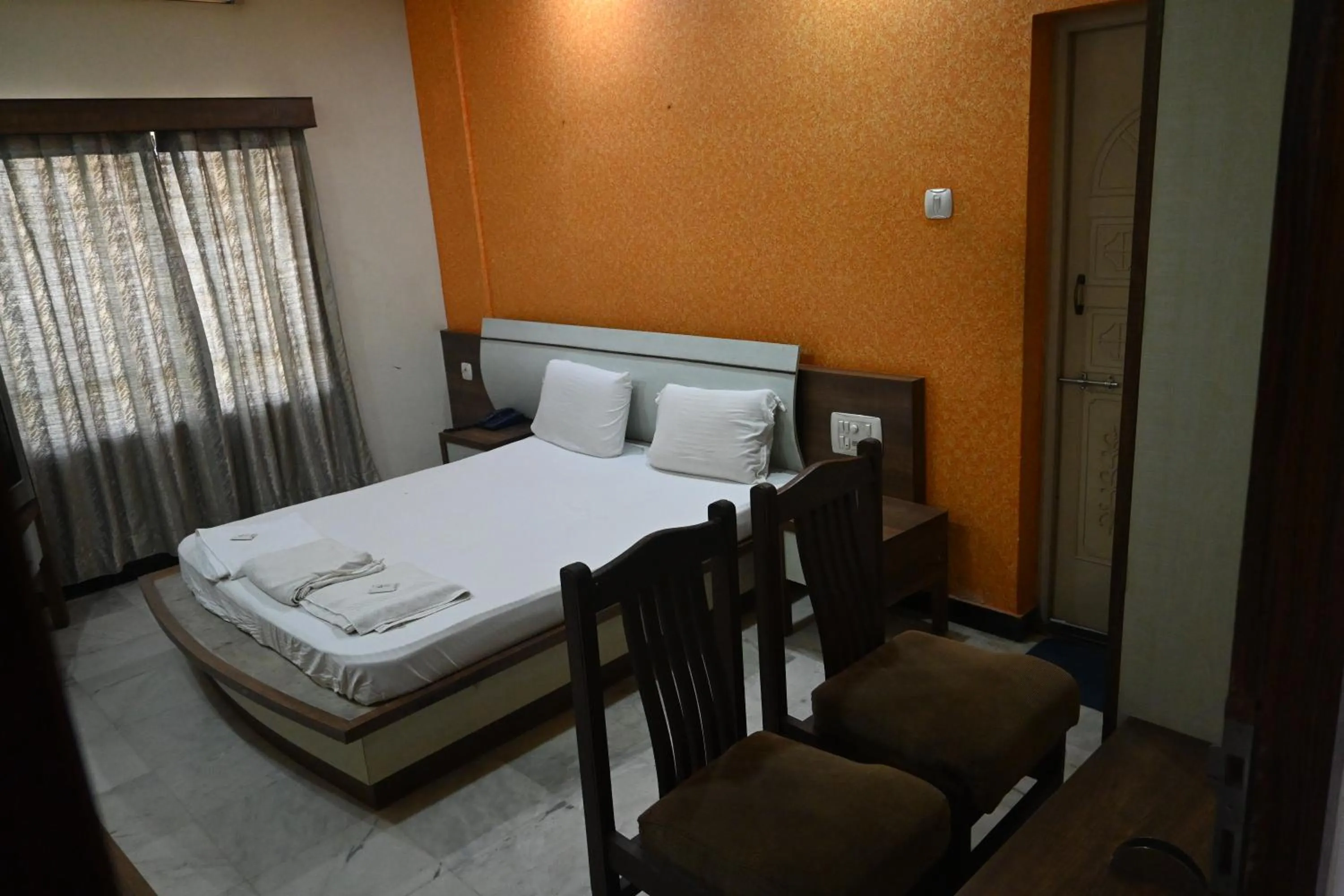 Bed in Hotel Ashlesh Manipal