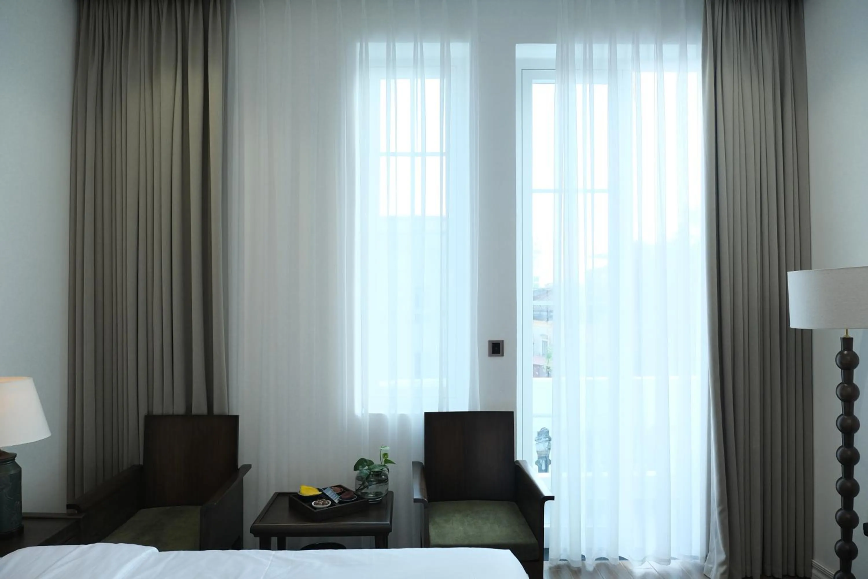 Living room, Bed in Paul Chabot Hotel