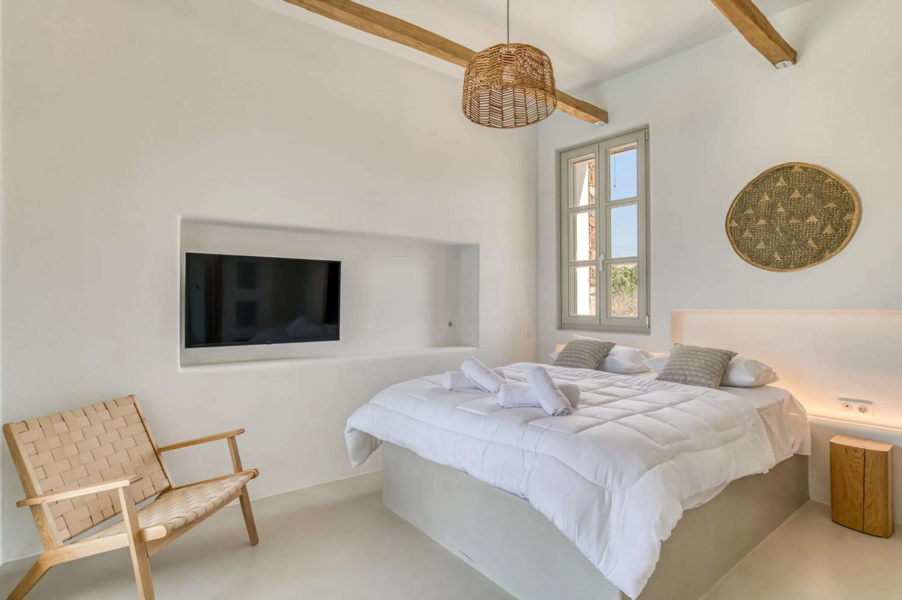 Bed in Lil Paros Luxury suites
