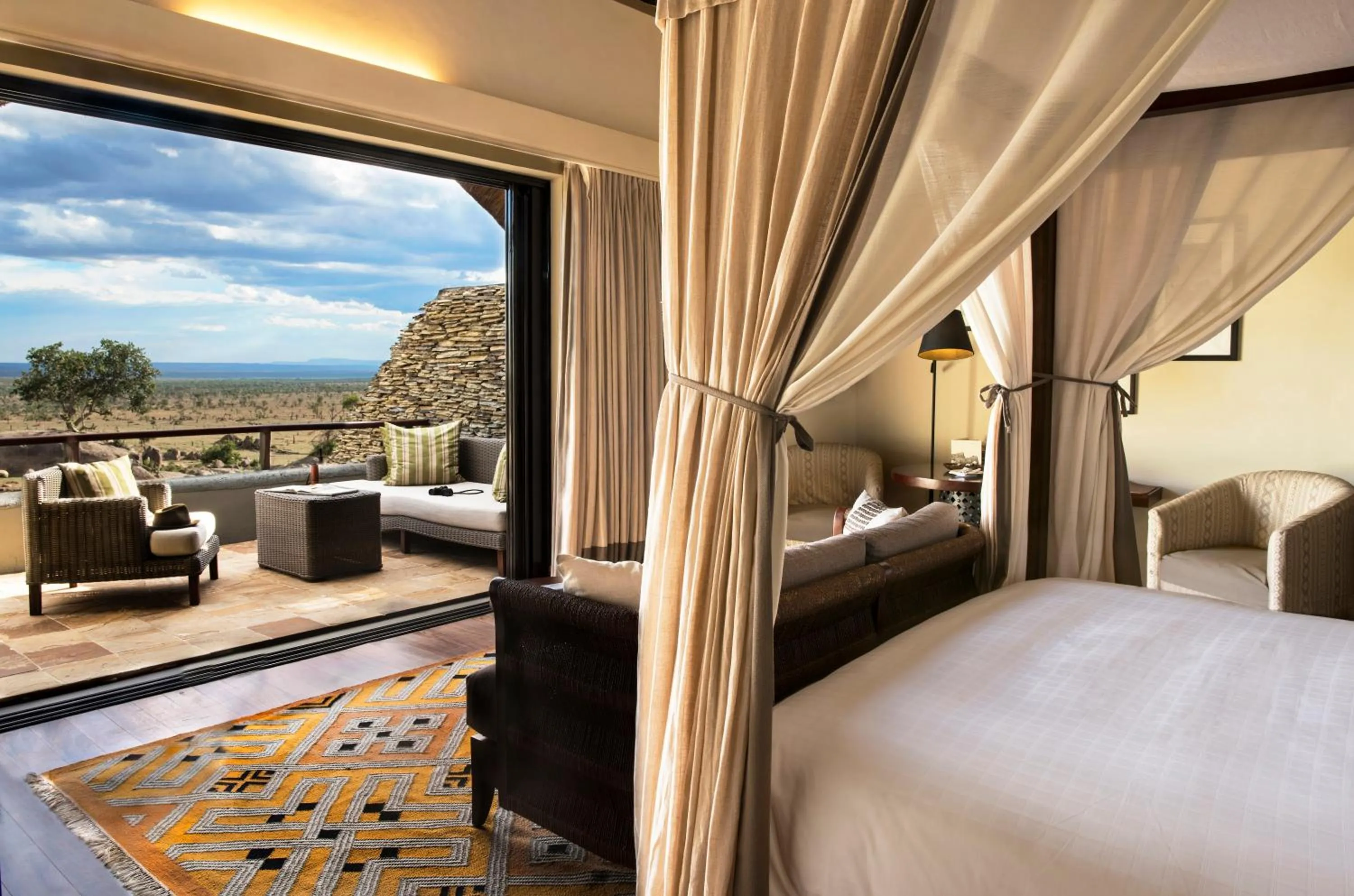 Balcony/Terrace, Bed in Four Seasons Safari Lodge Serengeti