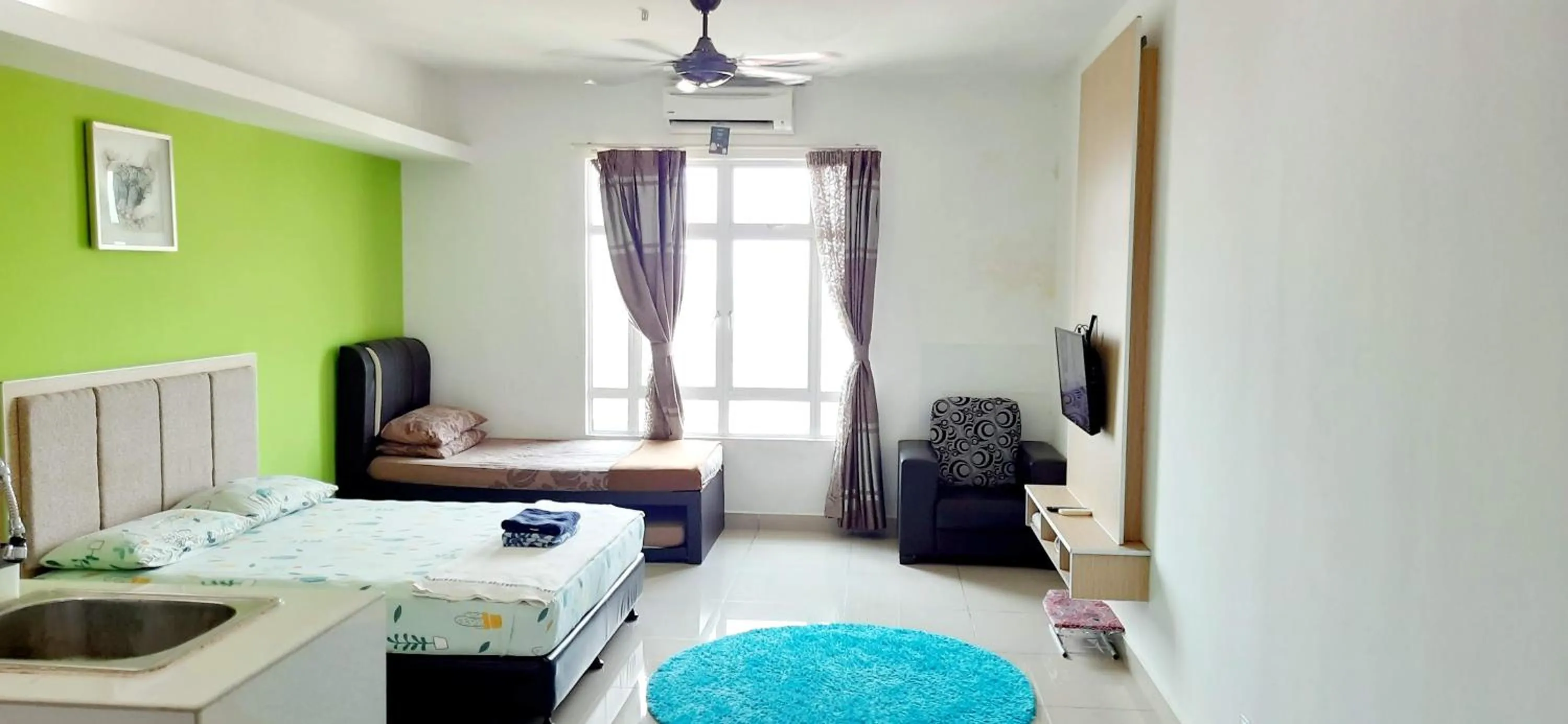 Bed in De Viana Apartments Homestay