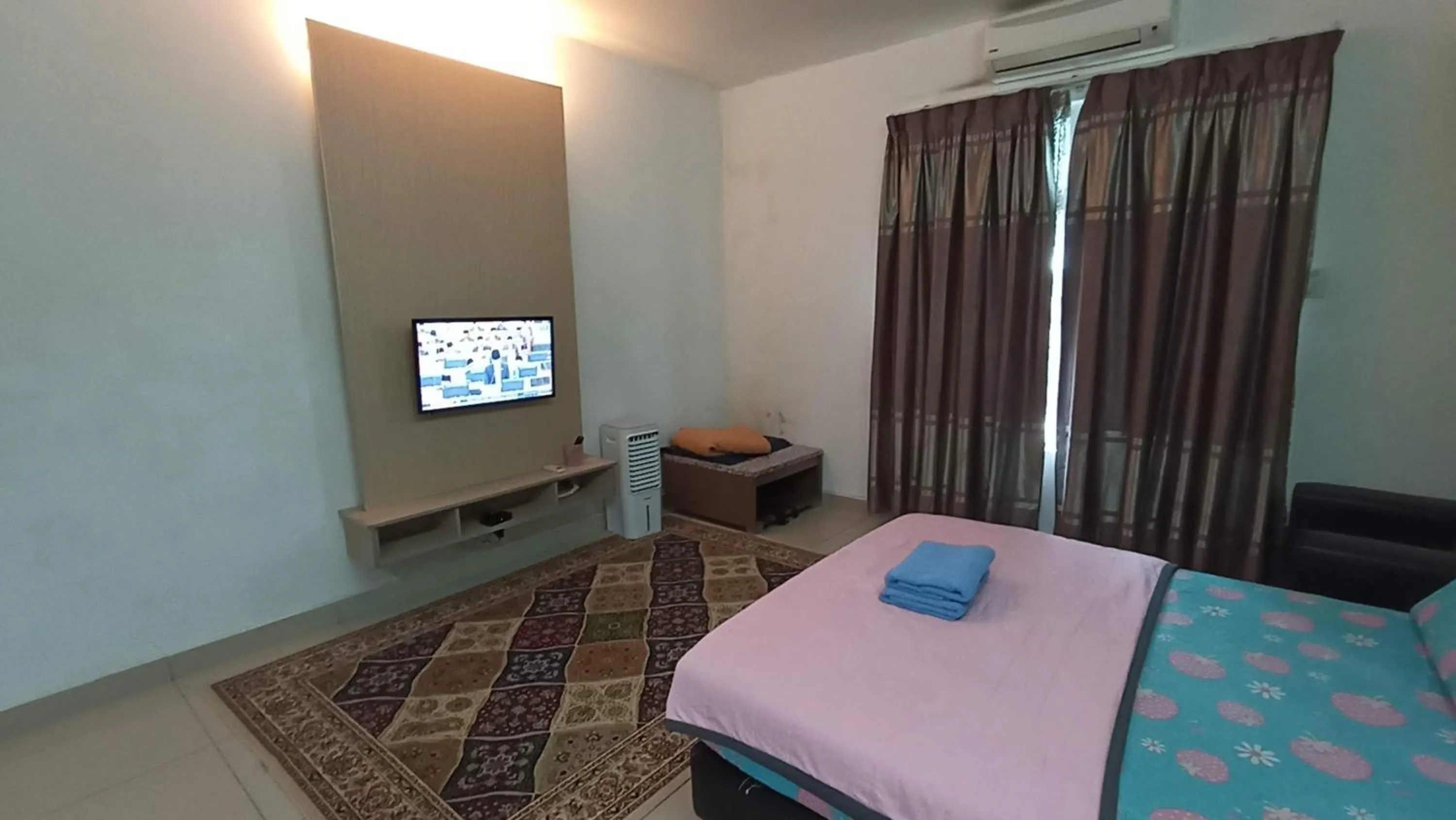 Bed in De Viana Apartments Homestay