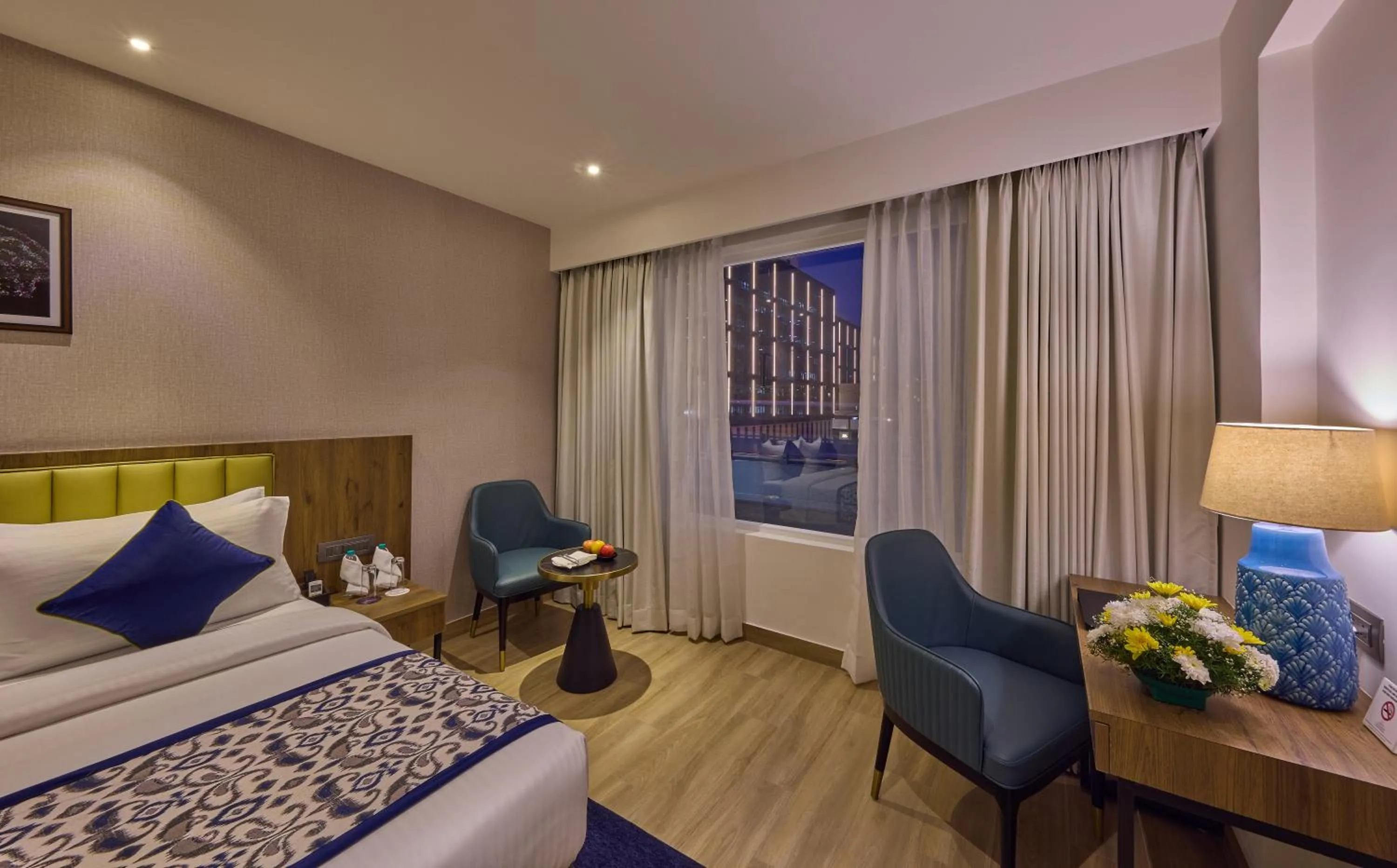 Bedroom, Bed in Grand Continent Hebbal A Sarovar Portico Affiliate Hotel