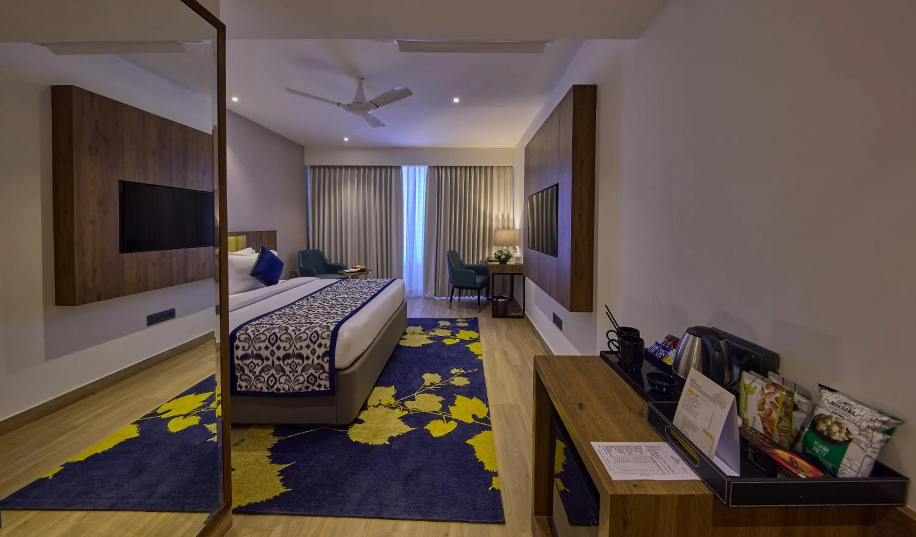 Bedroom in Grand Continent Hebbal A Sarovar Portico Affiliate Hotel