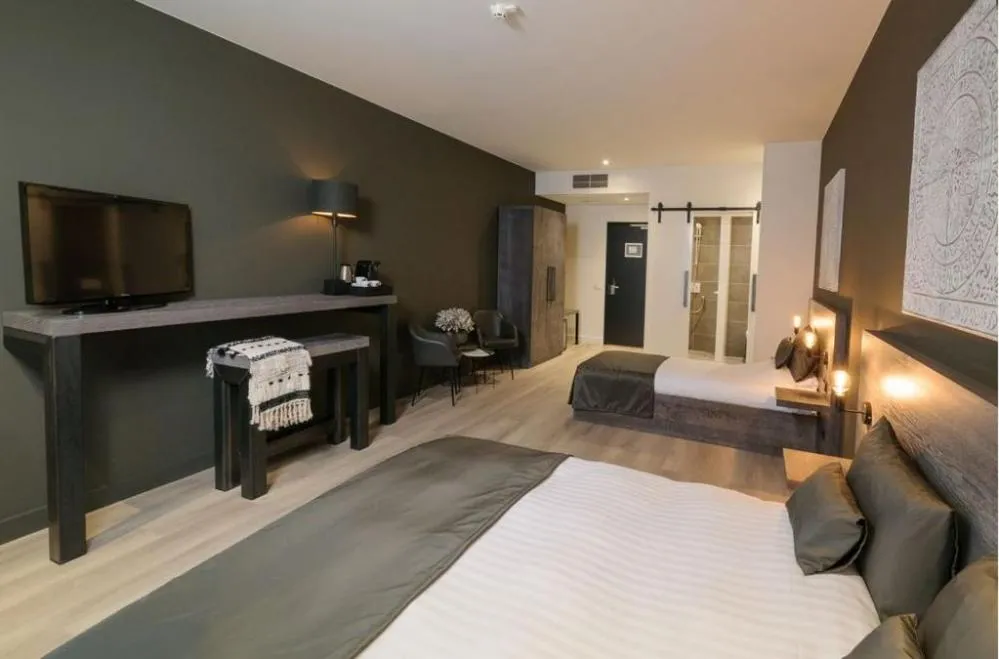 Bed in Hotel De Rustende Jager