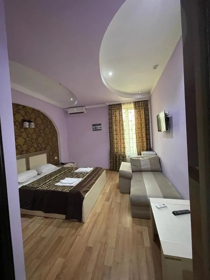 Bed in Lux Palace Hotel