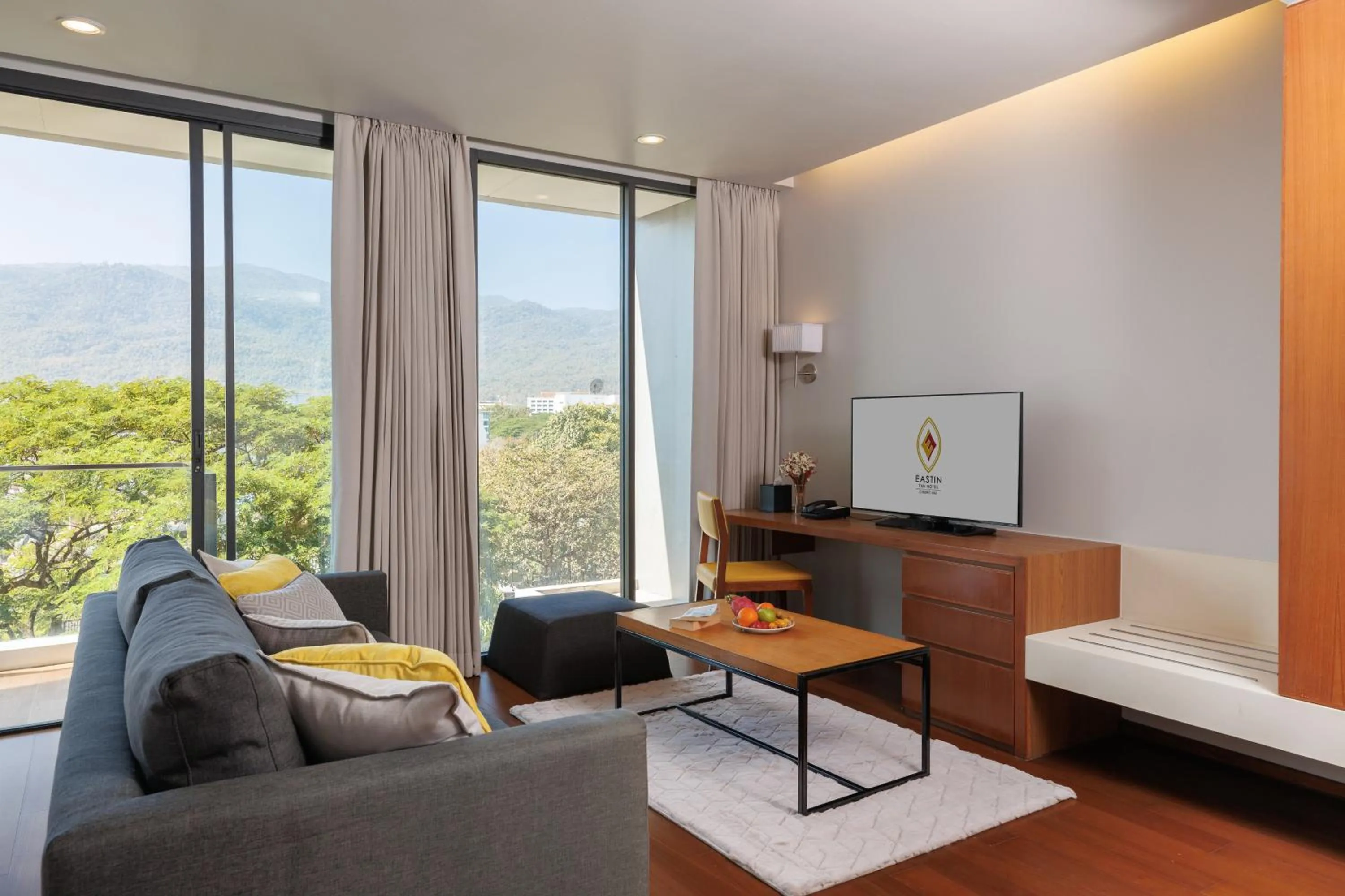 Seating area, Bed in Eastin Tan Hotel Chiang Mai