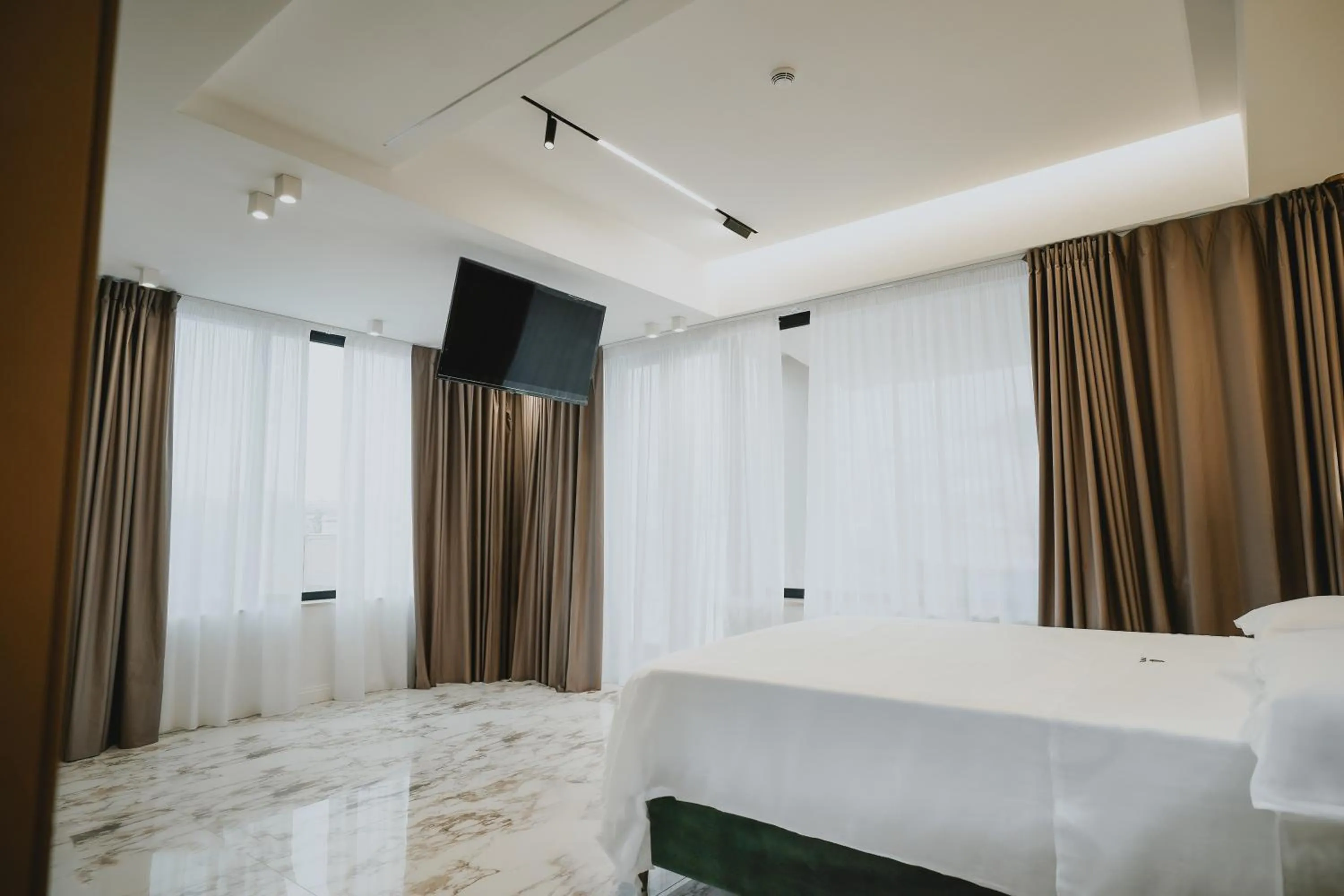 Bed in POETICA BOUTIQUE SKY HOTEL