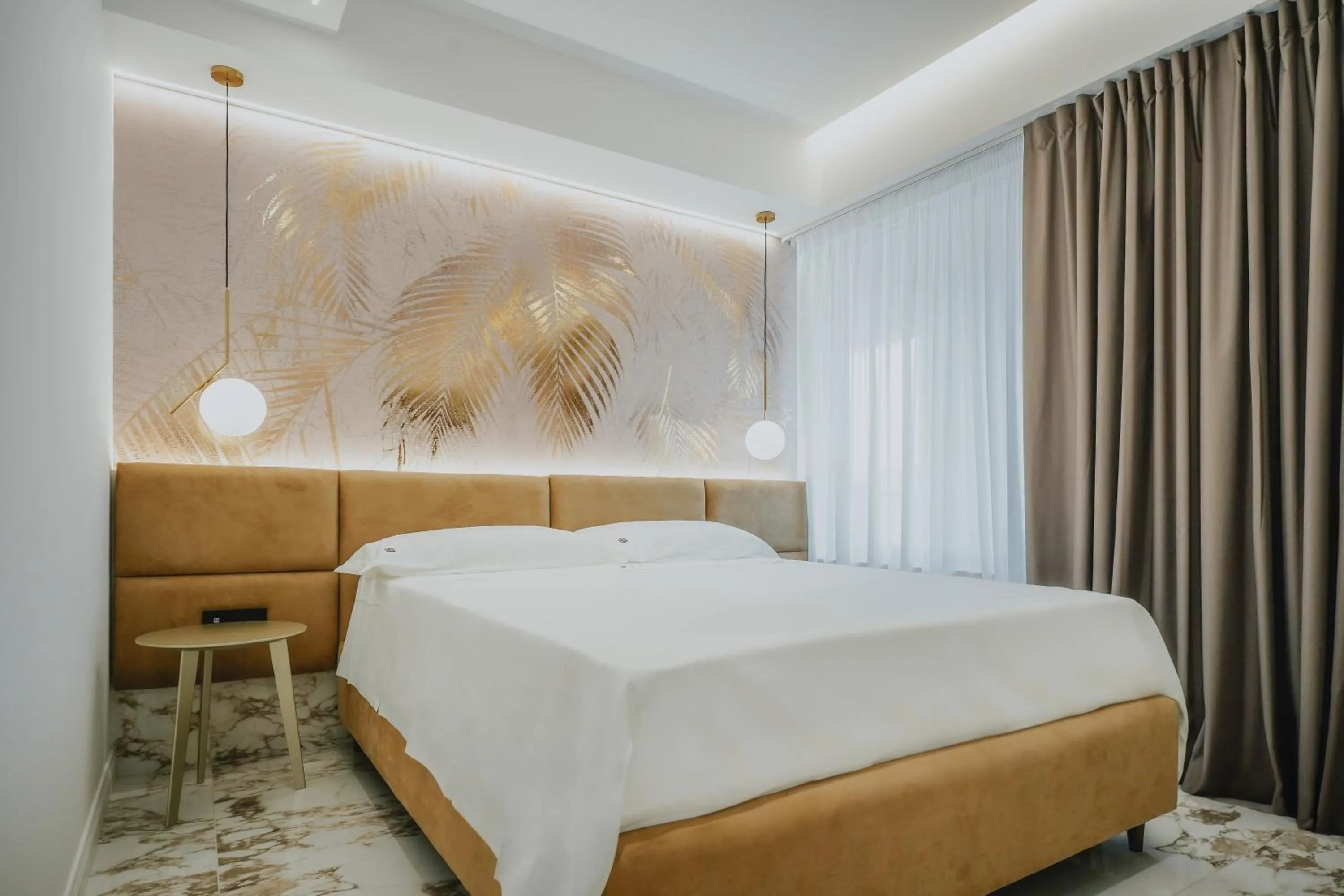 Bed in POETICA BOUTIQUE SKY HOTEL