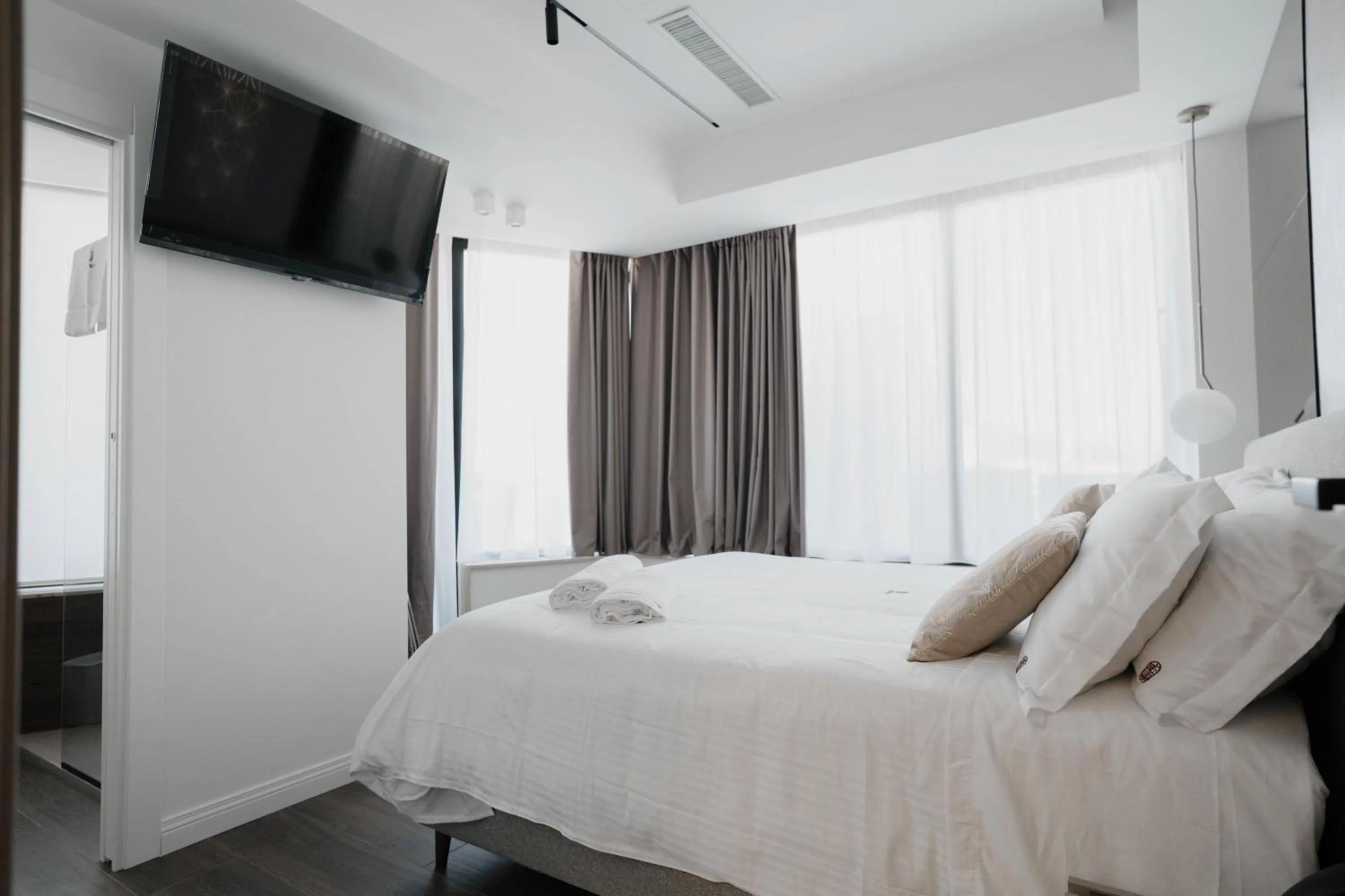 Bed in POETICA BOUTIQUE SKY HOTEL