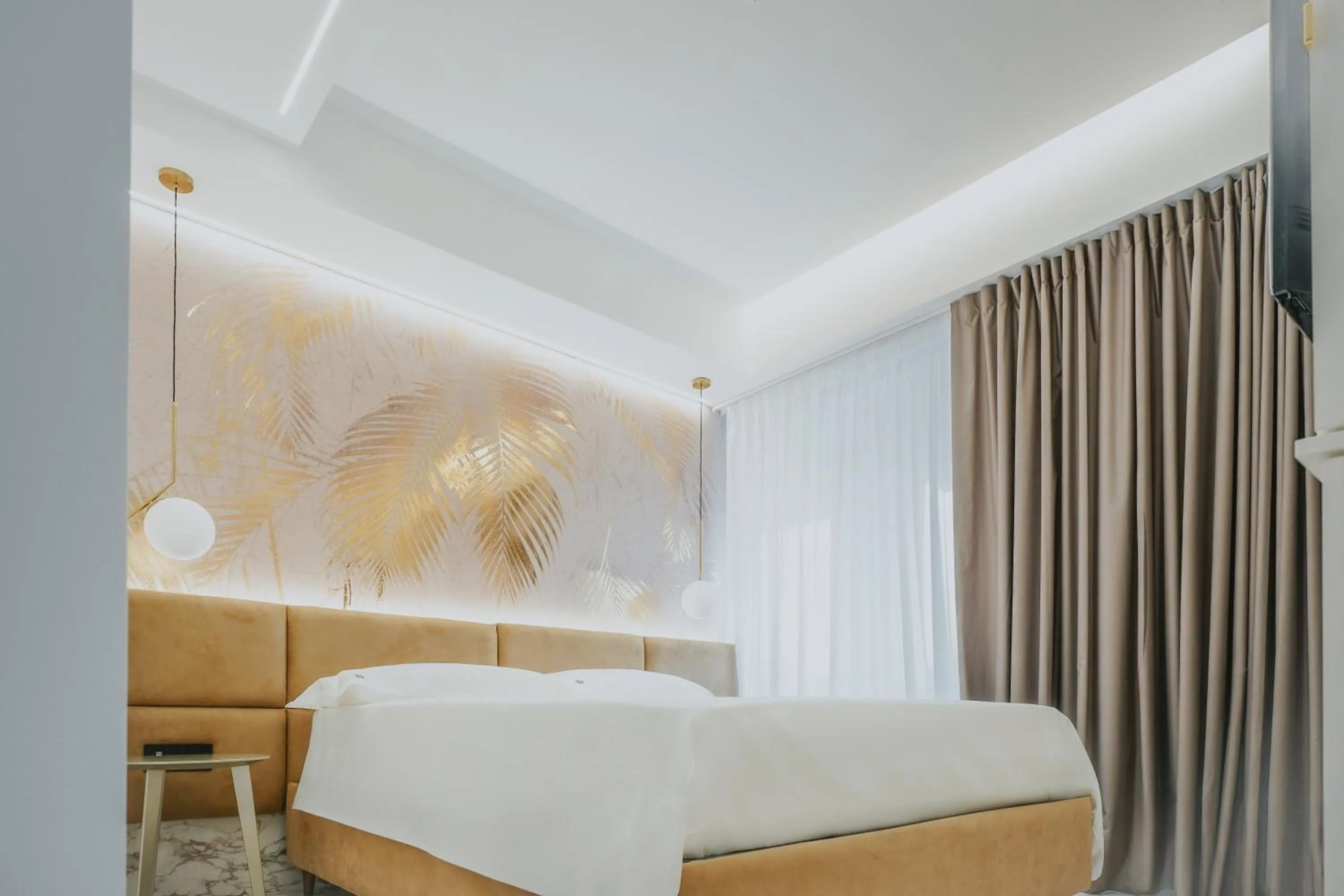 Bed in POETICA BOUTIQUE SKY HOTEL