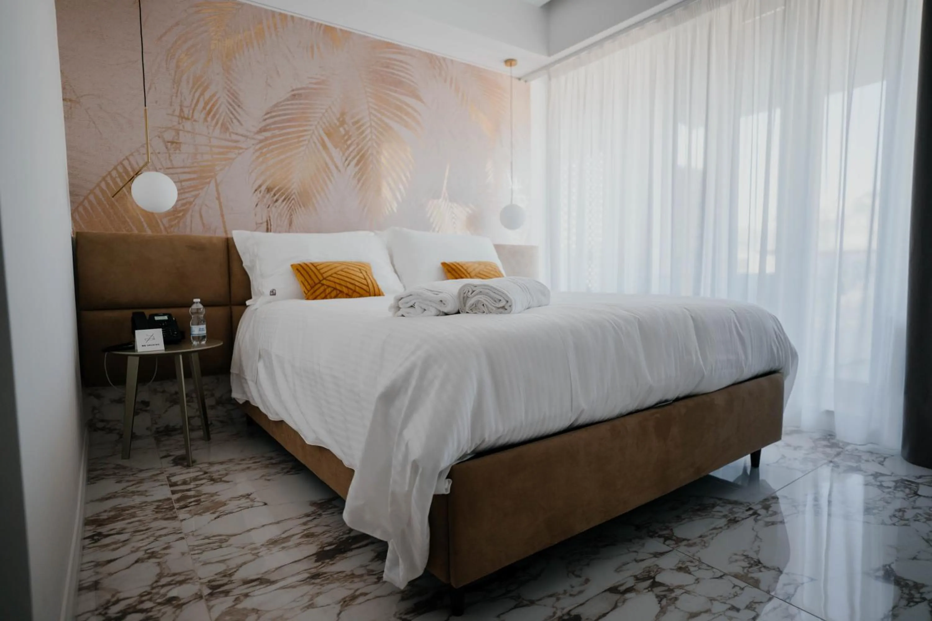 Bed in POETICA BOUTIQUE SKY HOTEL