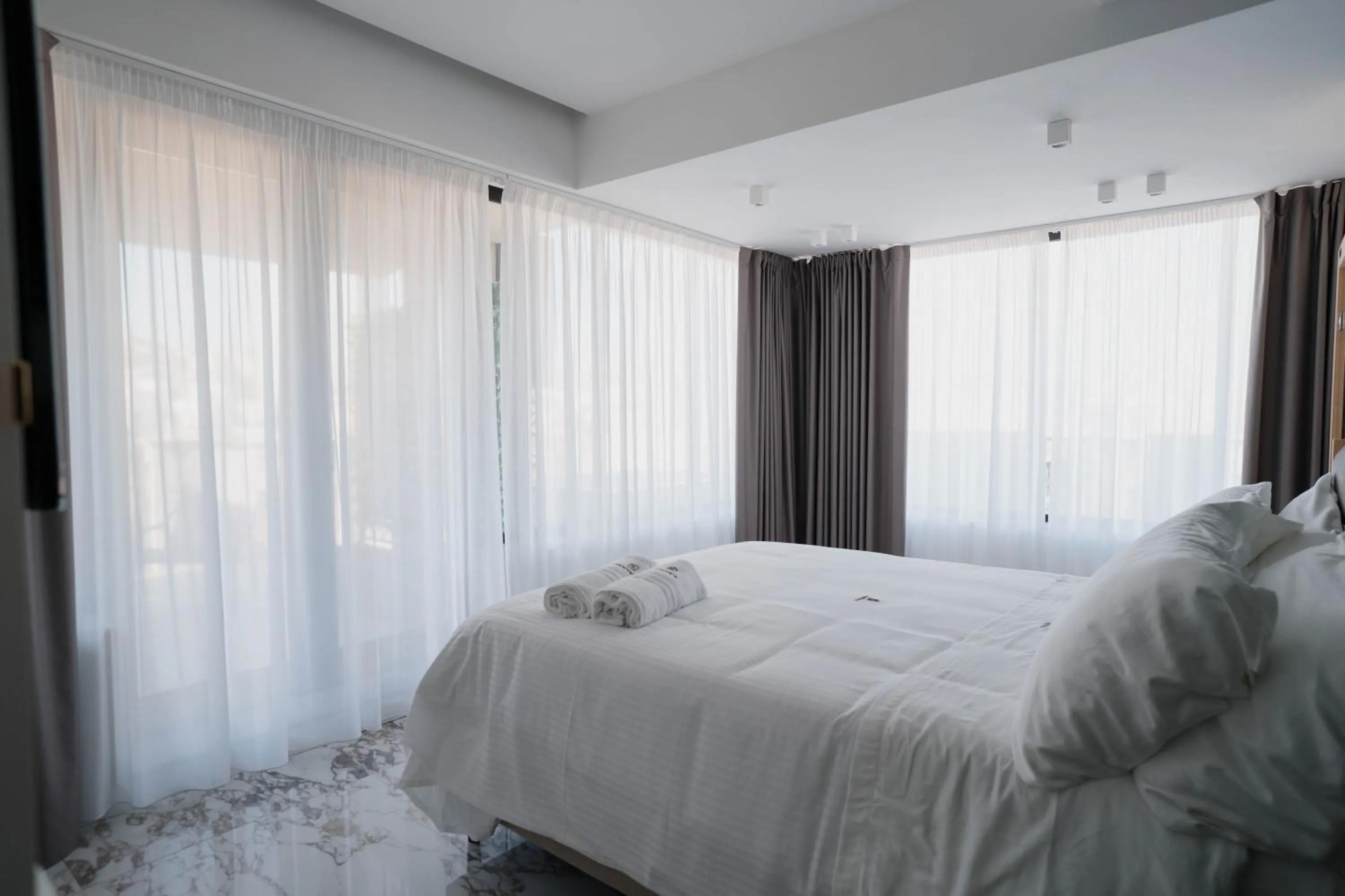 Bed in POETICA BOUTIQUE SKY HOTEL