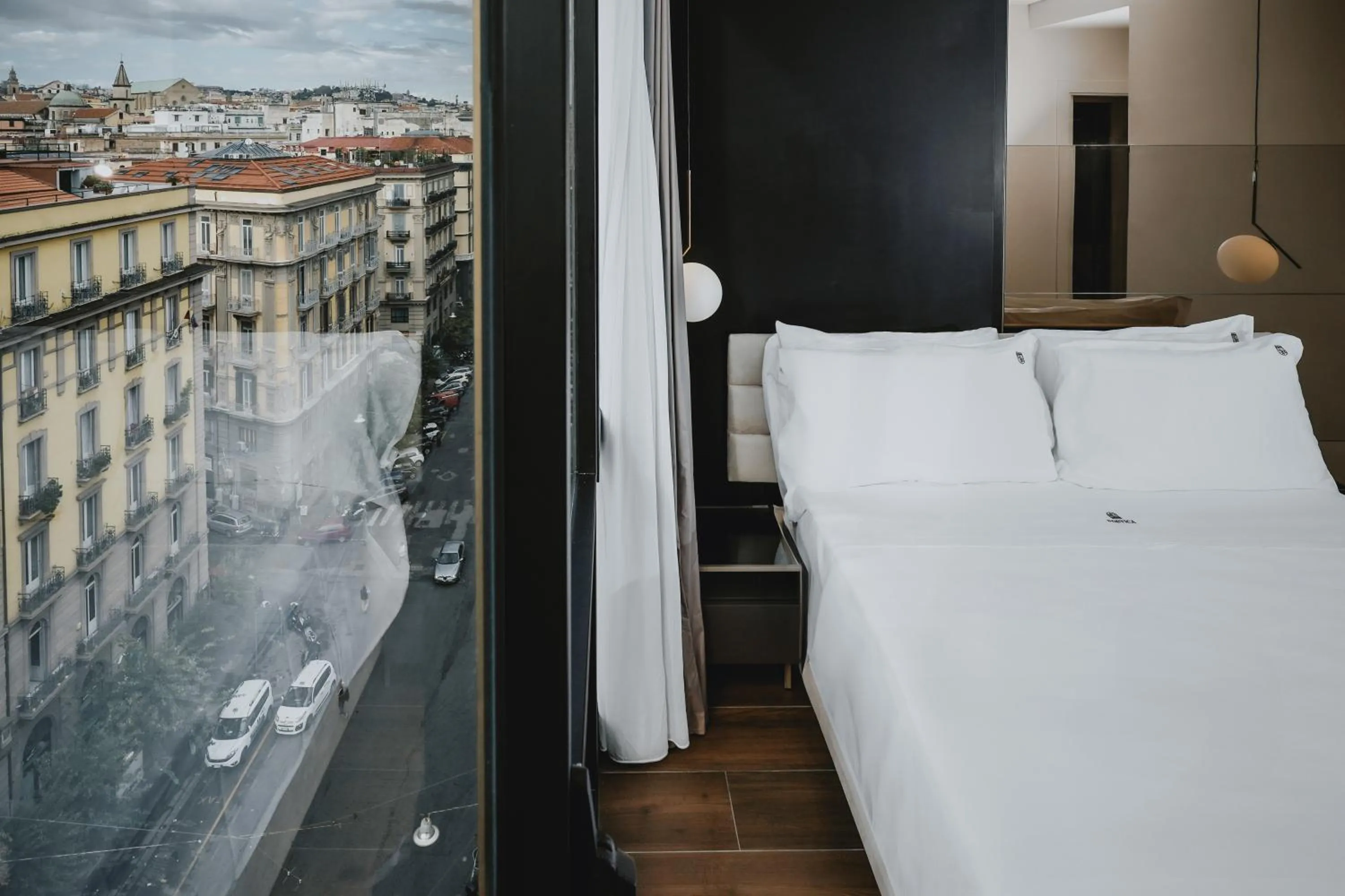 Bed in POETICA BOUTIQUE SKY HOTEL