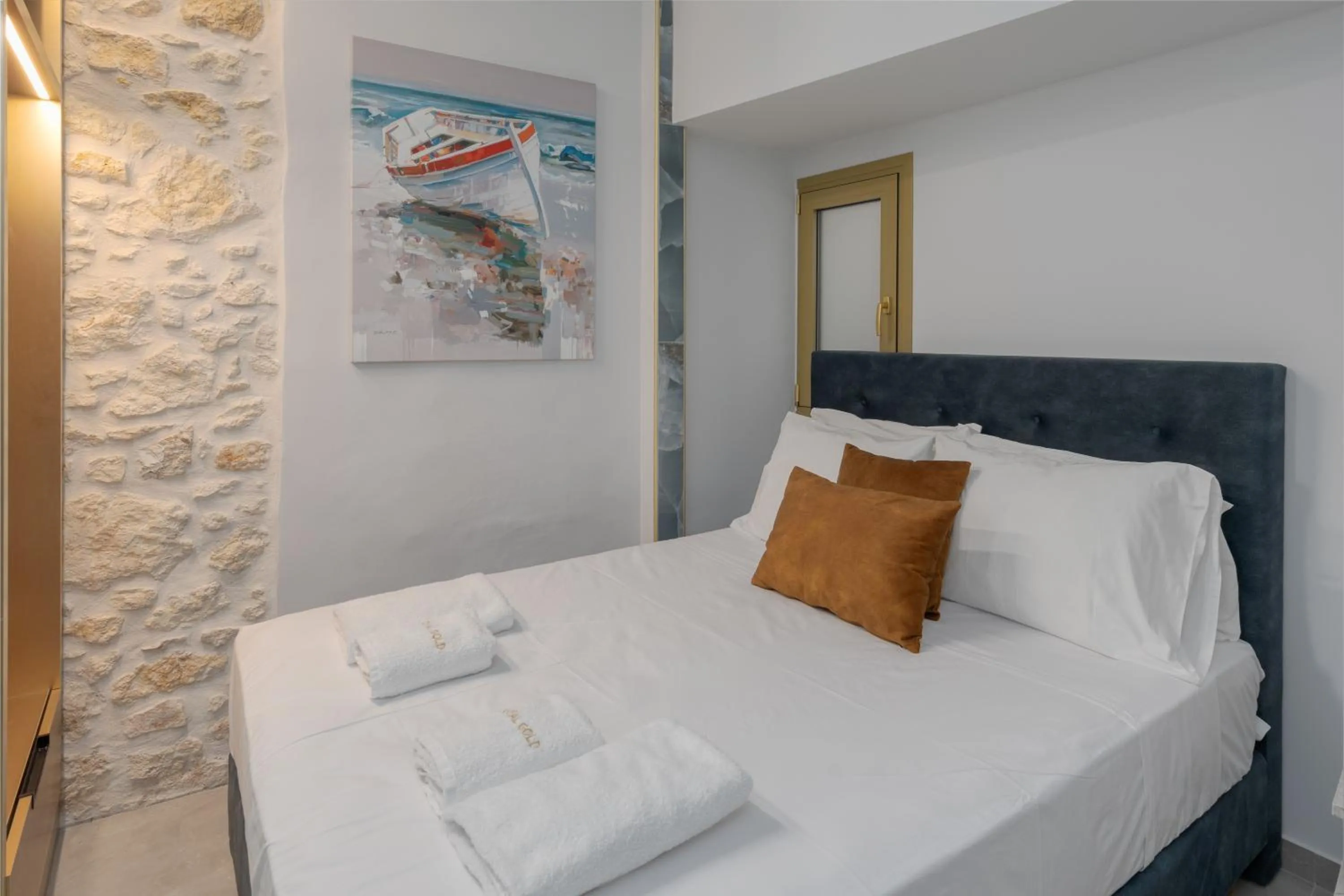 Bed in Royal Gold City Suites by Omilos Hotels