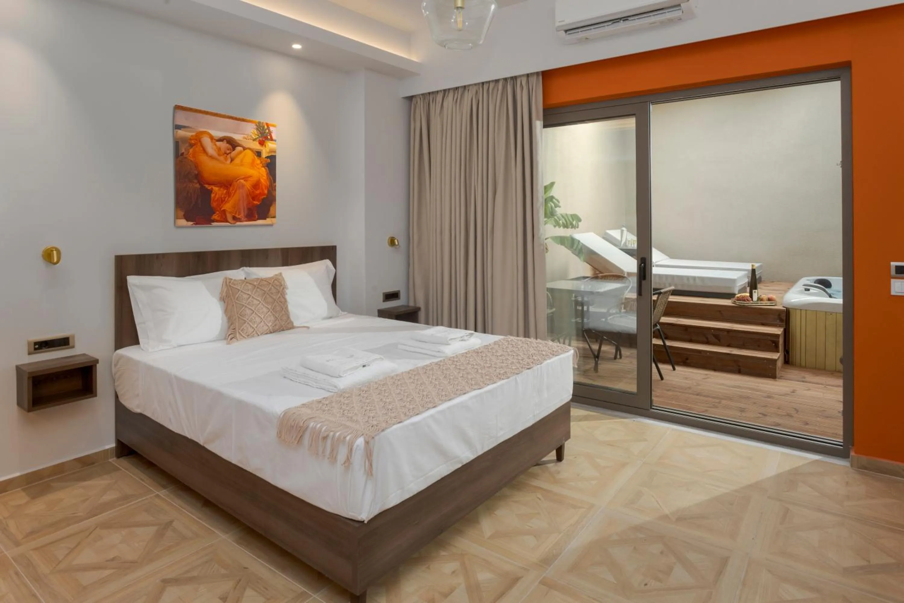 Bed in Royal Gold City Suites by Omilos Hotels