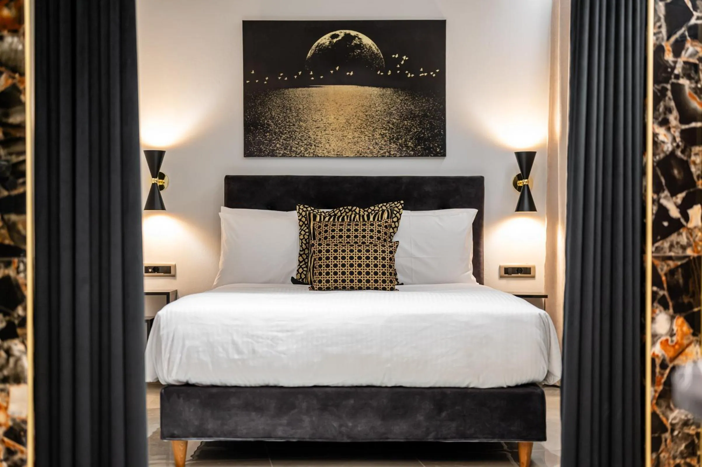 Bed in Royal Gold City Suites by Omilos Hotels