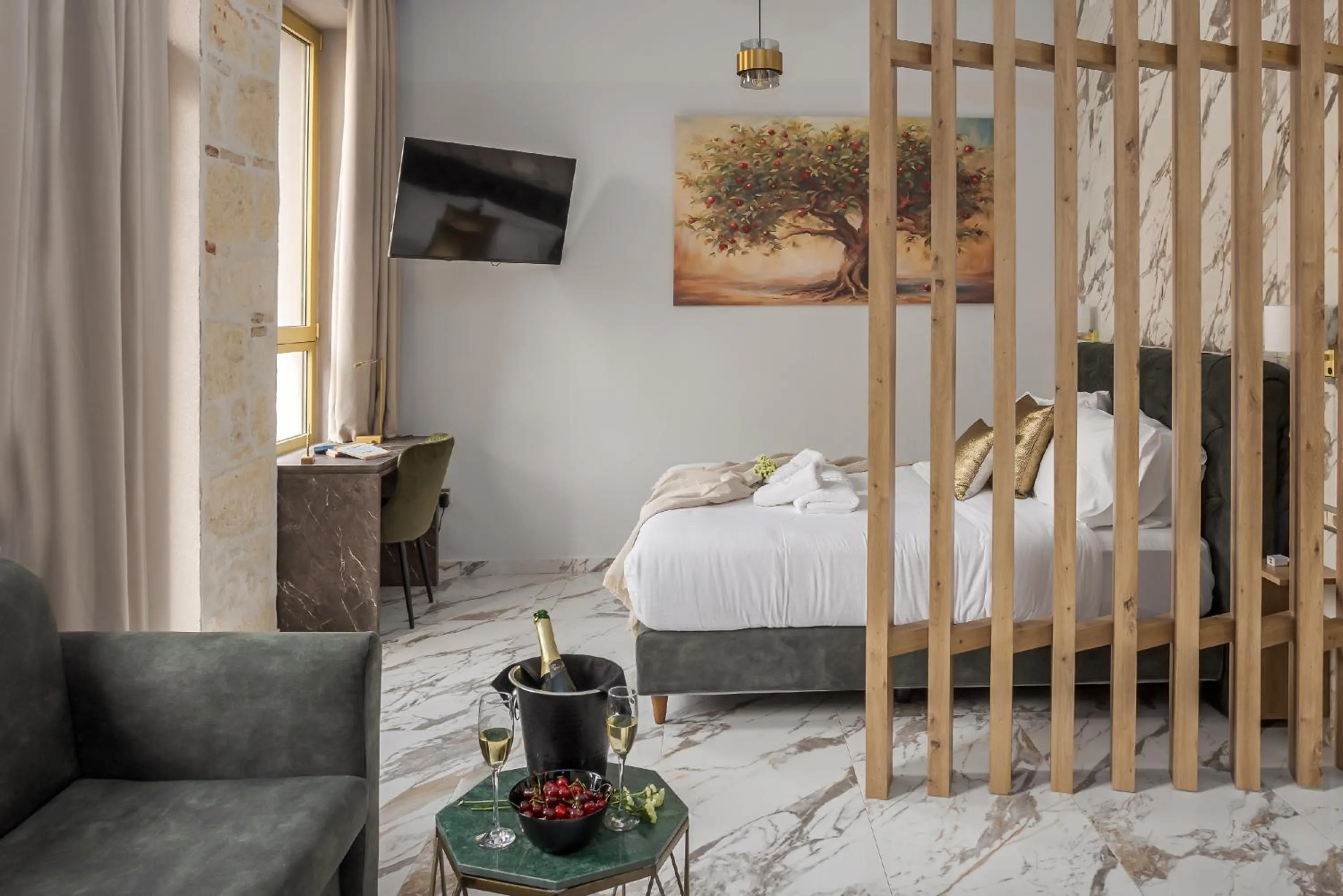 Bed in Royal Gold City Suites by Omilos Hotels