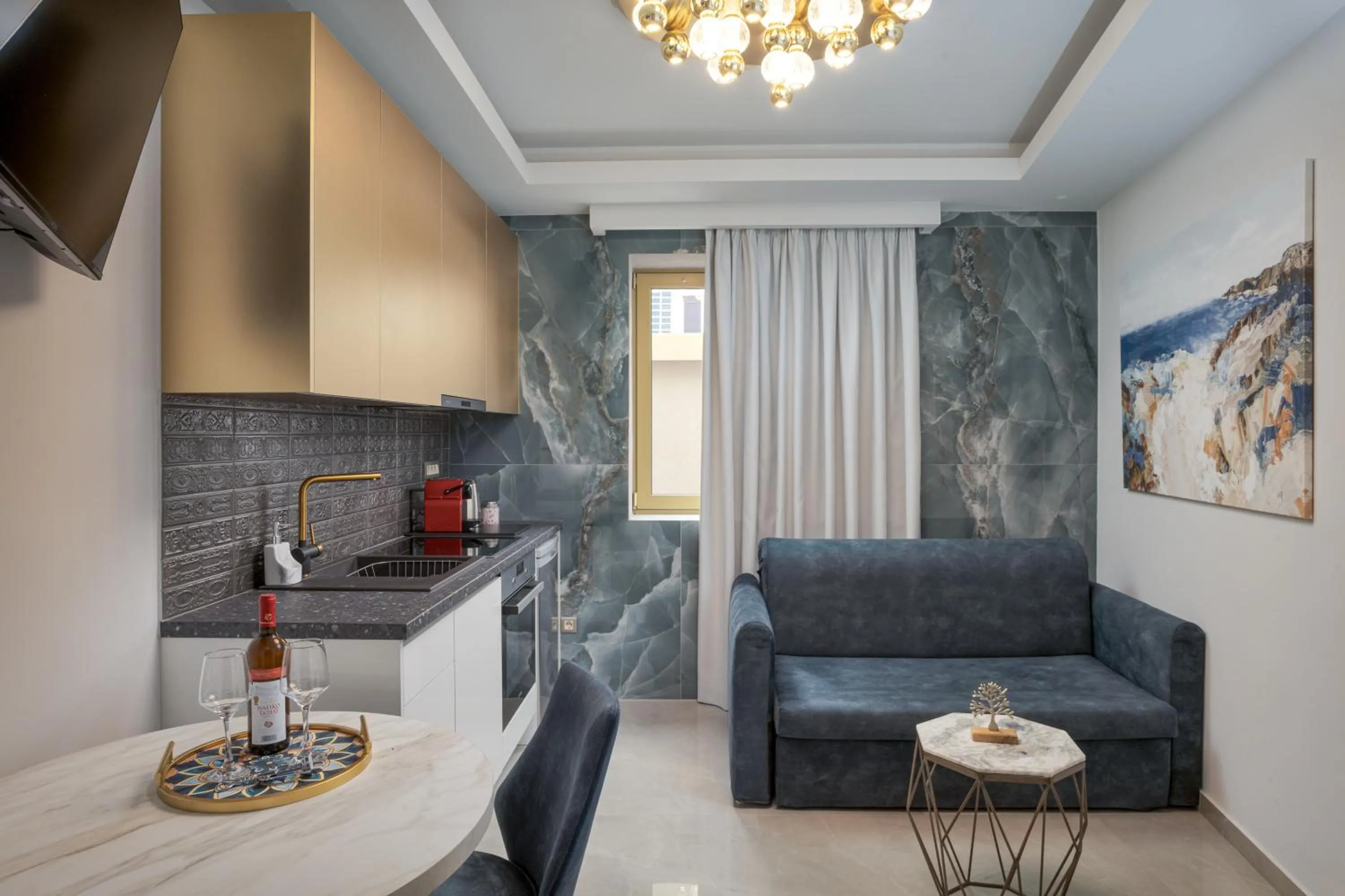 TV and multimedia in Royal Gold City Suites by Omilos Hotels