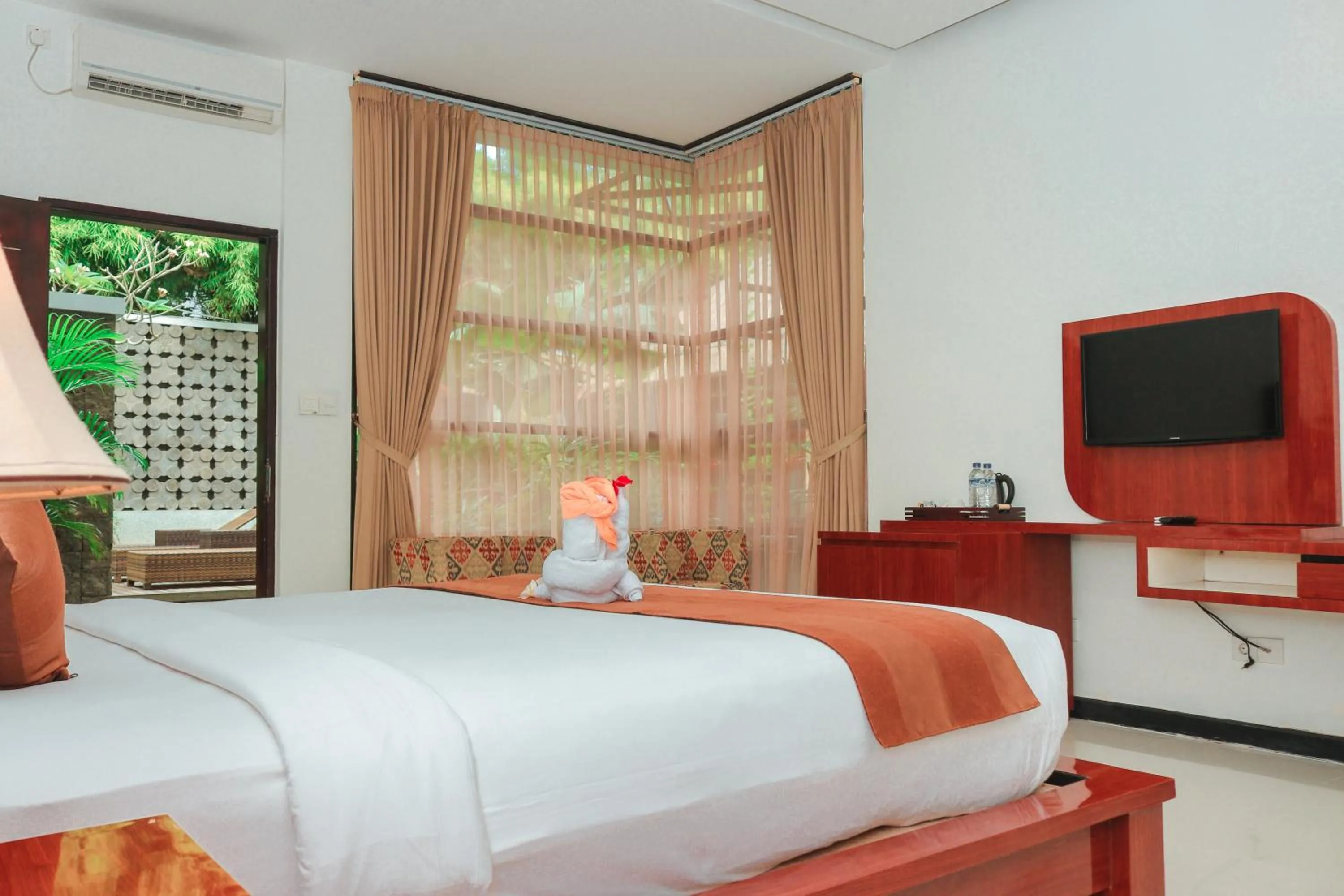 TV and multimedia, Bed in Argya Santi Suite and Villas